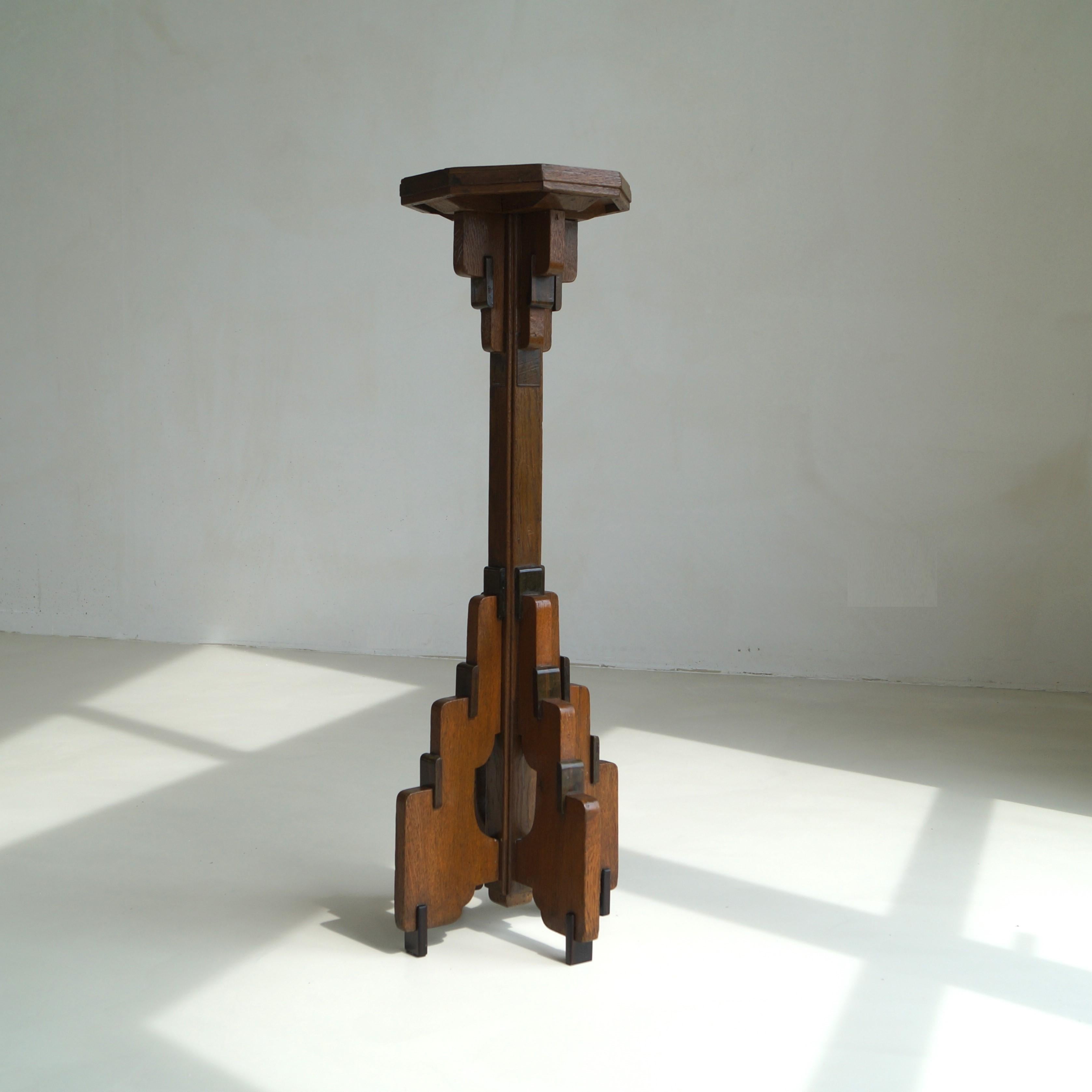 Dutch Haagse School 1920s plinth, pedestal or candle stand attributed to designer P.E.L. Izeren for ''De Genneper Molen''. 
This piece was most probably designed as an altar candle holder for a church. A rare modernist design, futurist even.
The