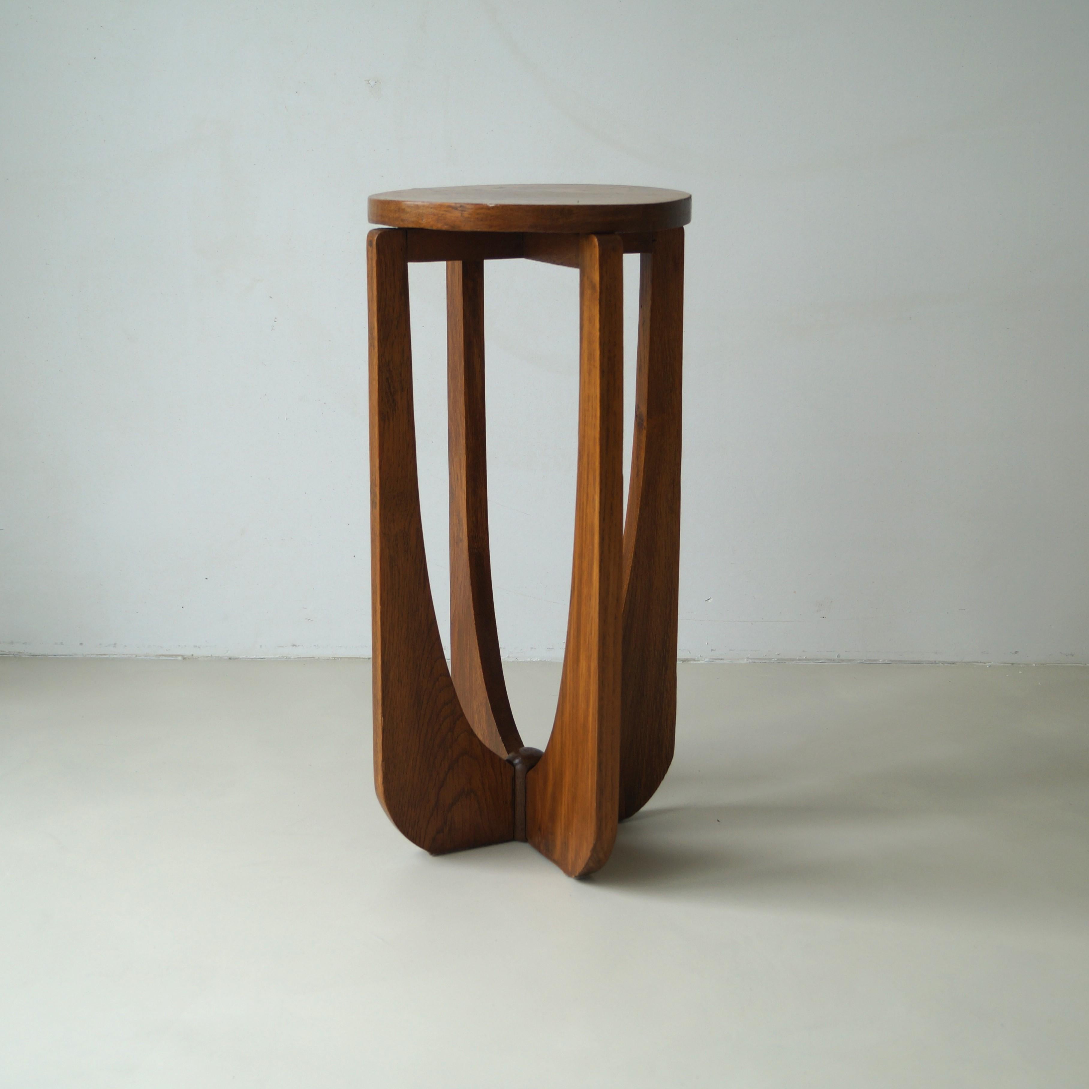 A Dutch Art Deco small elegant occasional table or side table, around 1920s, in solid oak with modernist lines. It is quite an unusual and stylish little table. Very suitable for interior styling.

The style is The Hague School but has some