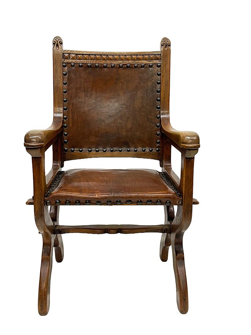 Dutch Art Deco oak and leather armchair, 1920s

An oak and brown leather armchair from the Art Deco period, 1920s, The Netherlands. The wood has a beautiful handcut wooden pattern of Fleur-de-Lis flower, right and left side on top of the chair and a