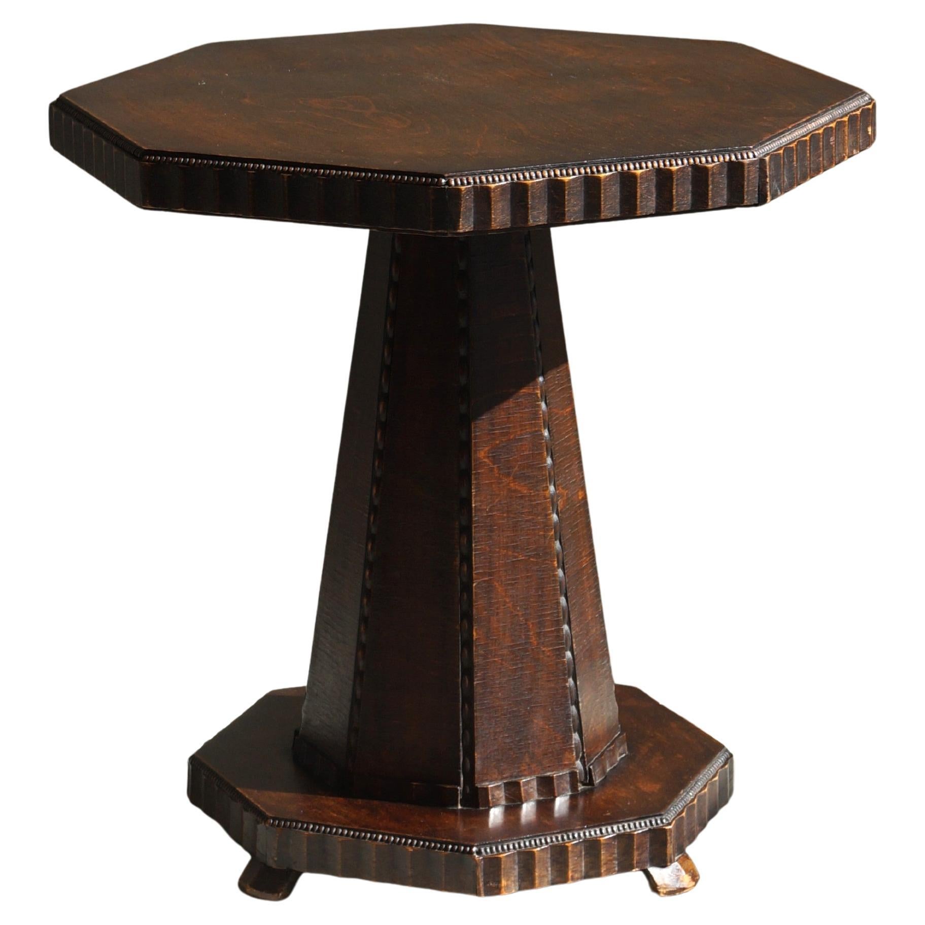 Dutch Art Deco Octagonal Amsterdam School table with a sculptural design, 1920s