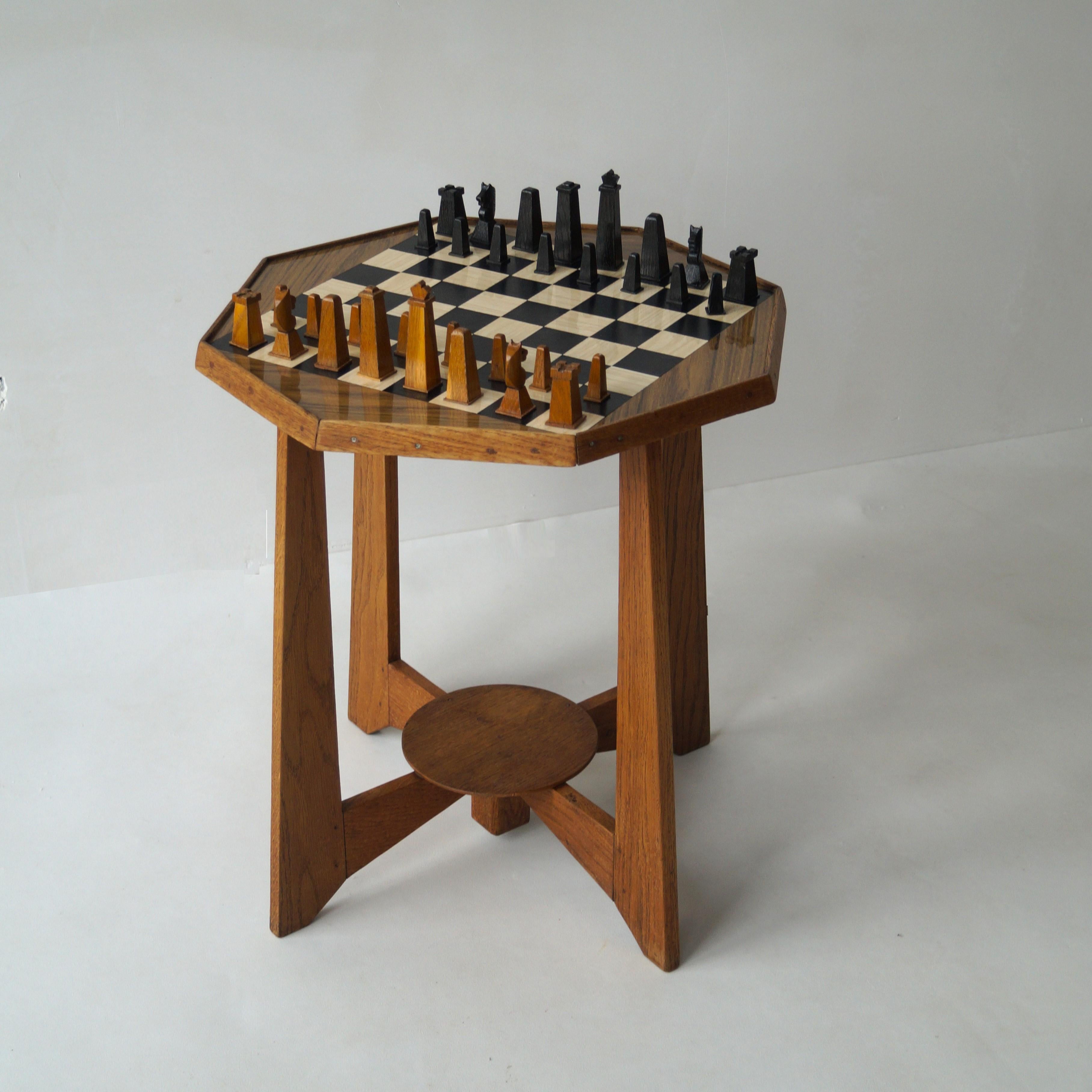 A modernist - Dutch Art Deco one of a kind octagonal chess table with inlay of formica. Estimated around the 1950s to 60s, because the chess board is in formica, a sort of plastic, well known from the West German plant table tops.

The base of the