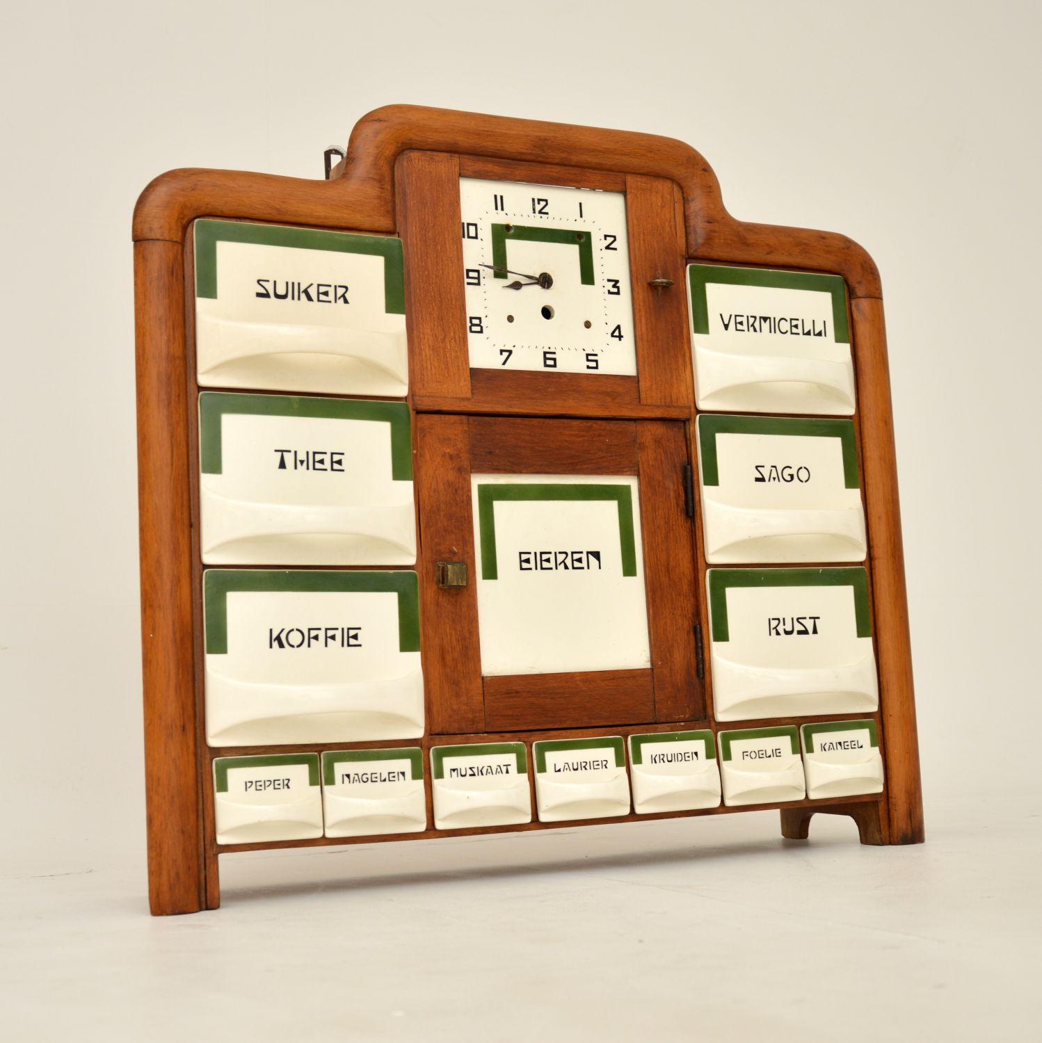 An interesting and very well made Art Deco period spice rack. This was made in the Netherlands in the 1930’s.

It is a beautiful and very practical item, perfect for use in the kitchen. It has a solid birch frame, shaped in the typical Art Deco
