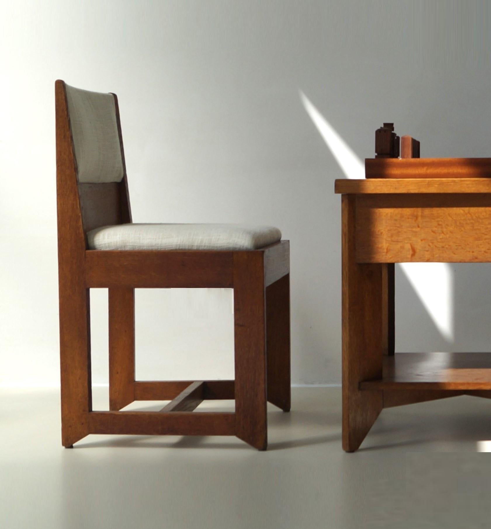 Complete game table set up with a contemporary handmade modernist wooden chess set included. 
This furniture set of two chairs and a table was designed by Hendrik Wouda and manufactured by Pander, 1924. The design is well documented (see the last