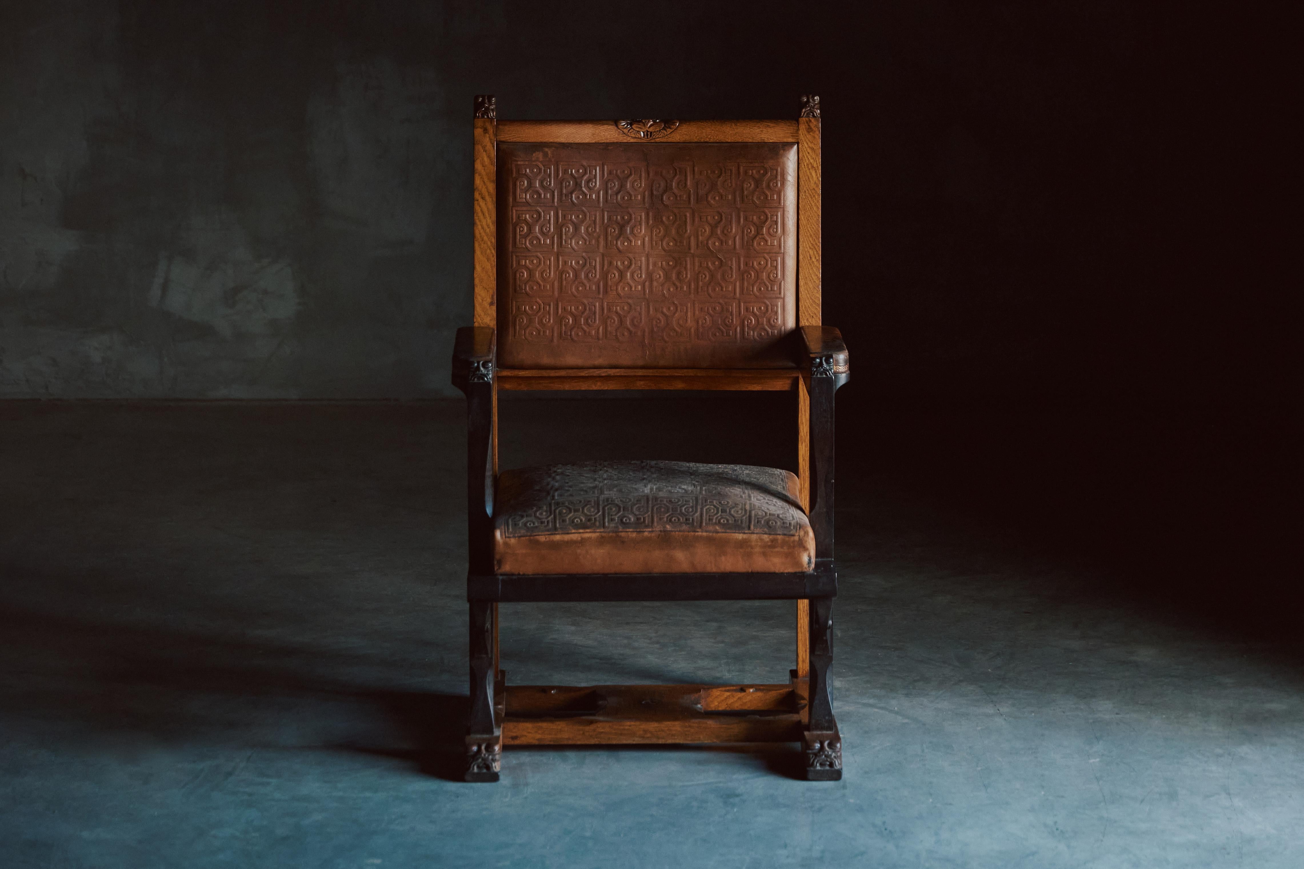 Exquisite museum-quality Lion Cachet armchair, an opulent masterpiece meticulously crafted from the finest oak, macassar ebony, and rosewood, adorned with stunning wood-carved details that elevate it to a league of its own. This regal piece pays