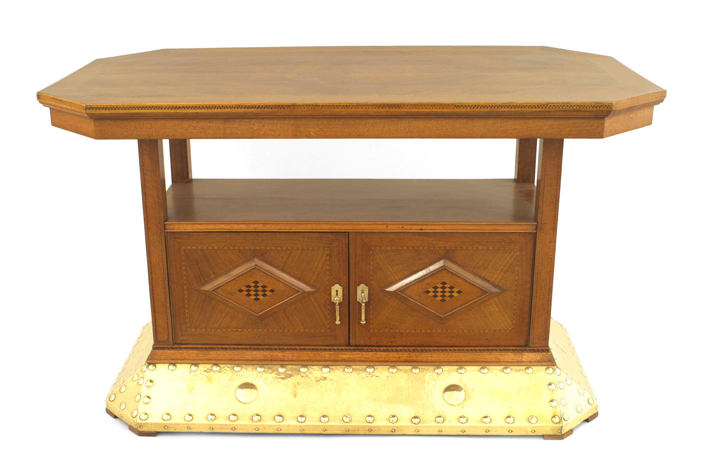Continental Dutch Arts & Crafts walnut and oak rectangular center table with banded inlaid trim and a bottom shelf over 2 doors with diamond design resting on a flared brass trimmed base.
   