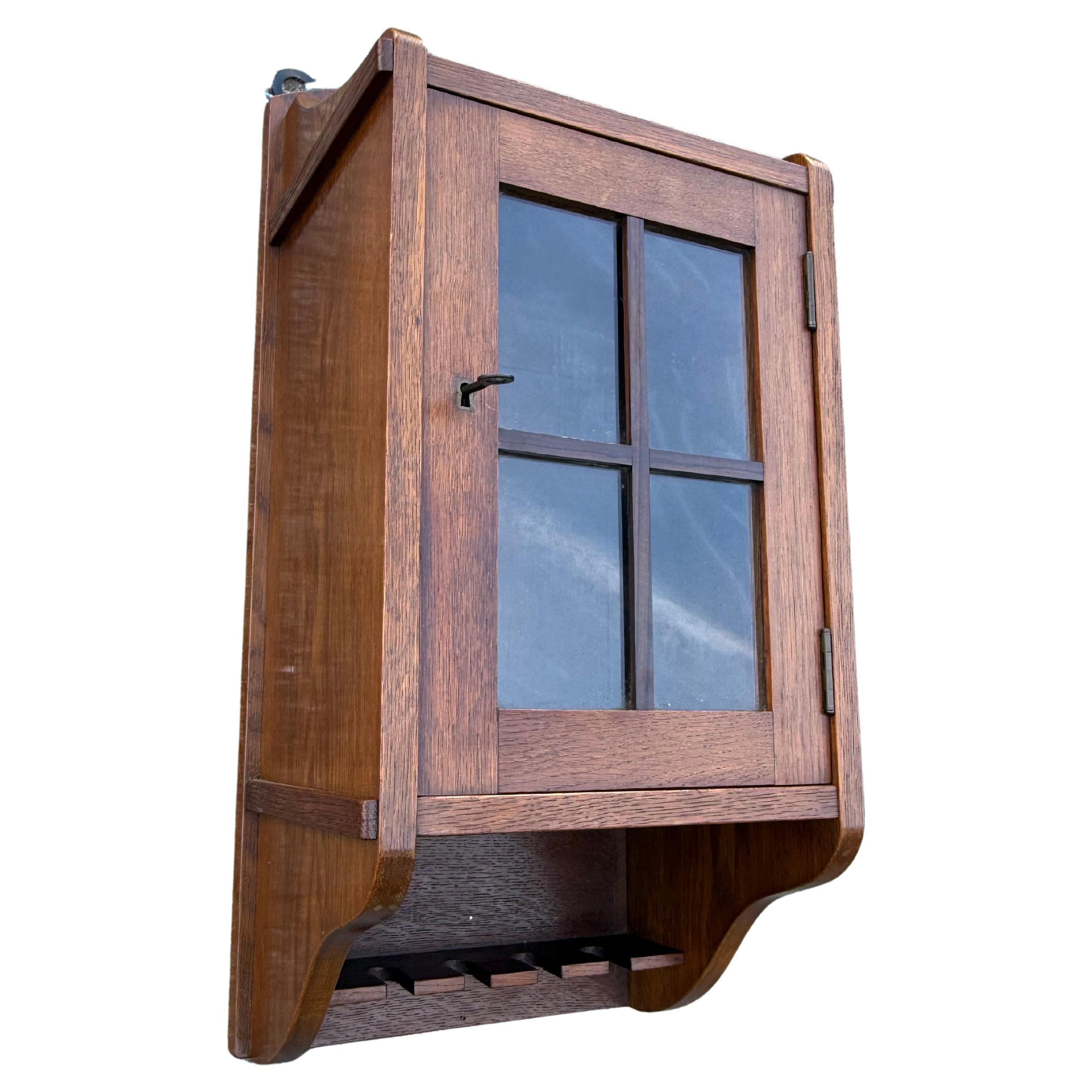 Dutch Arts & Crafts Oak Pipe Wall Hanging Cabinet with Glazed Door, circa 1910