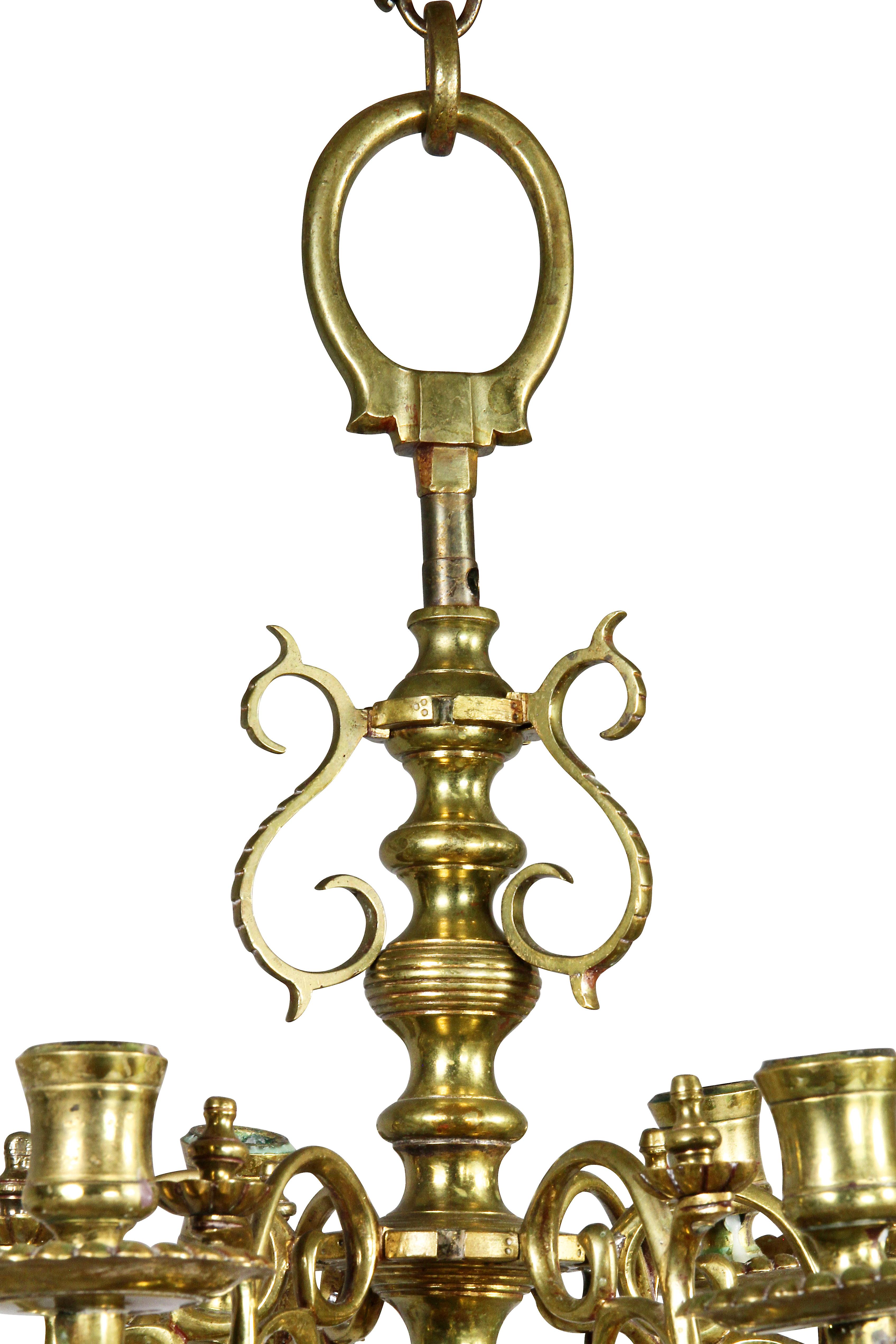 With two tiers of six lights attached to a turned stem with large sperule at base.
Provenance; Fogg Art Museum. Bobeche and candleholder drilled for wire.