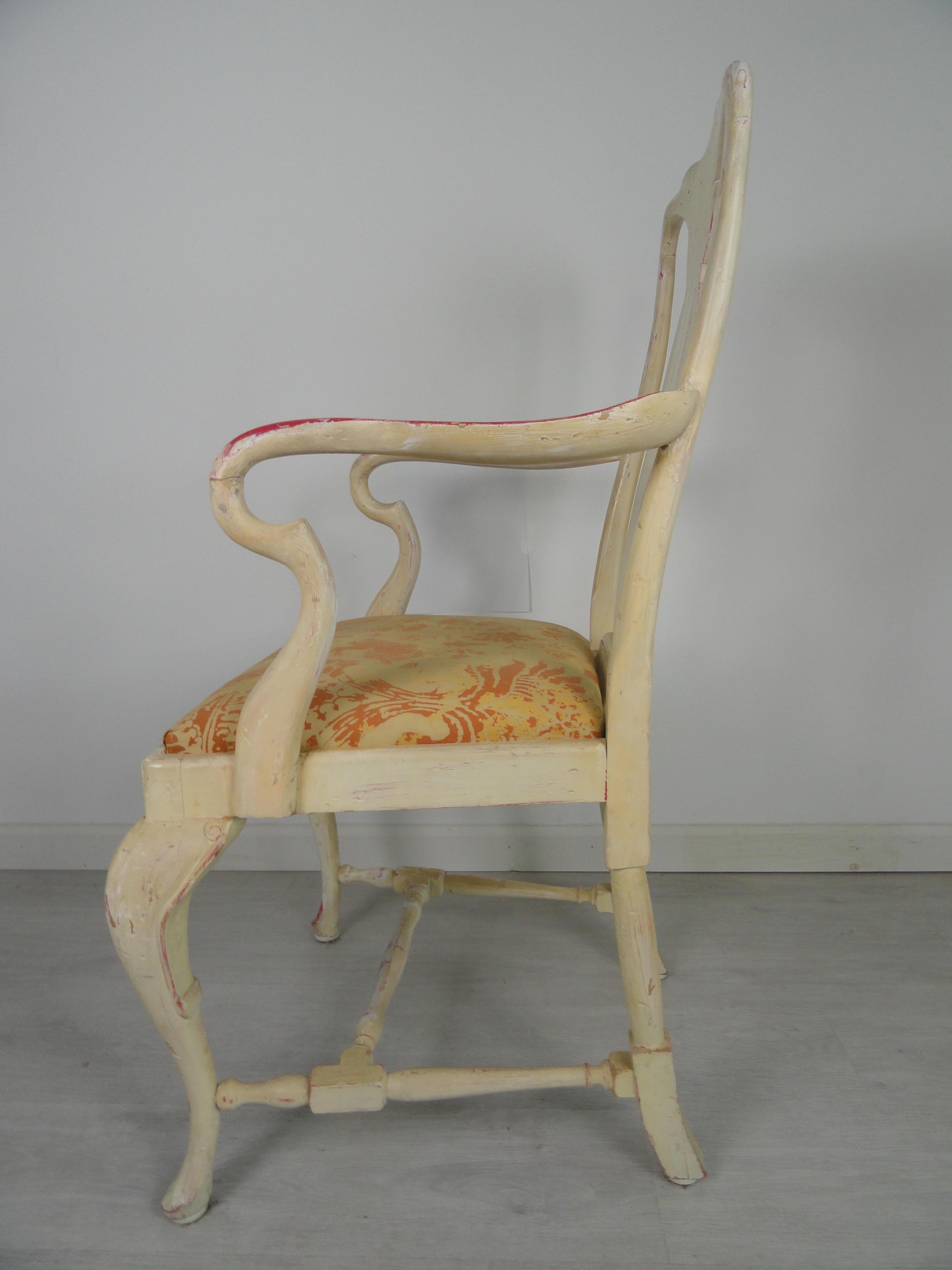 Wood mahogany painted Dutch chair with cabriole legs connected by a carved bridge. The seat is upholstered in cotton Italian fabric. Beautiful patina, especially on the arms.