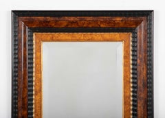 Dutch Baroque Style Ebonized Gilt Ripple Mold Framed Mirror with Beveled Glass