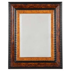 Dutch Baroque Style Ebonized Gilt Ripple Mold Framed Mirror with Beveled Glass
