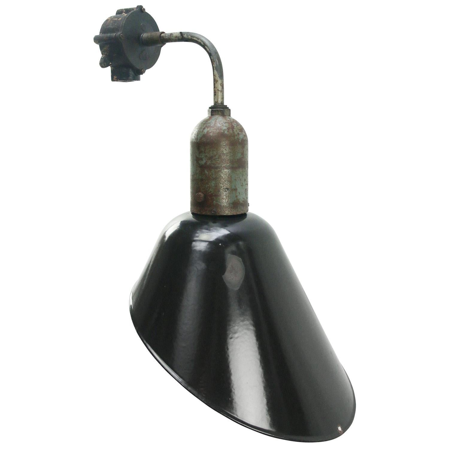 Factory wall light.
Black enamel, white interior.

Measures: diameter cast iron wall piece: 10.5 cm, 2 holes to secure.

Weight: 3.20 kg / 7.1 lb

Priced per individual item. All lamps have been made suitable by international standards for