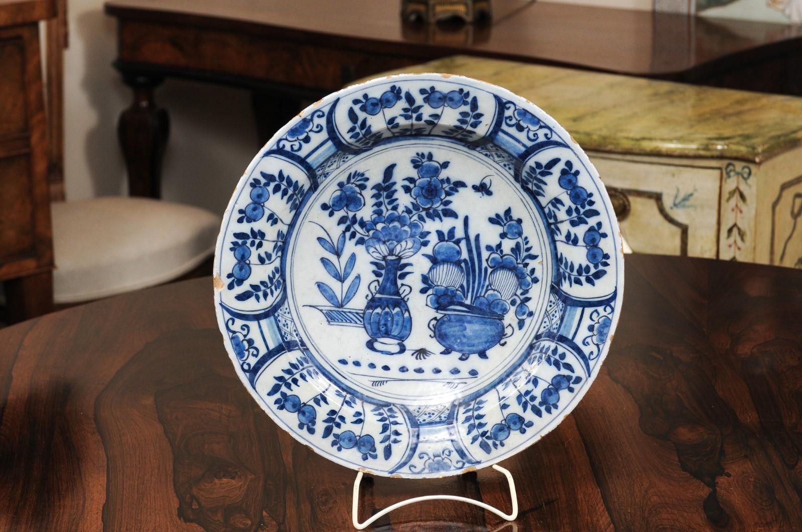 The 18th century Dutch blue and white charger with foliate design.

 