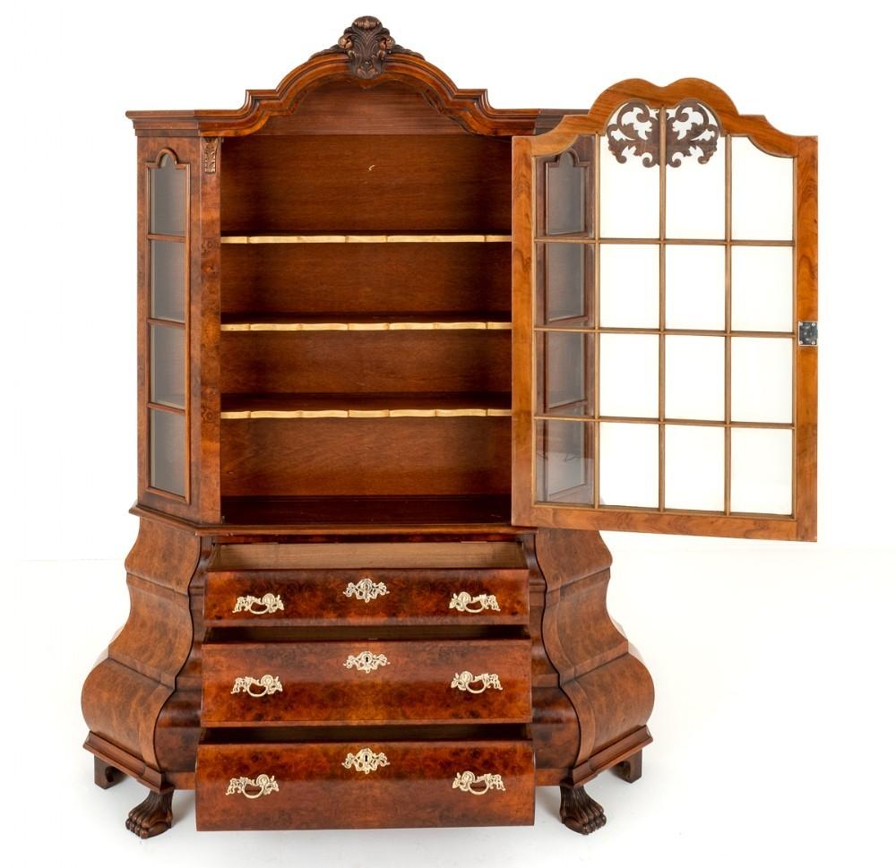 Burr Walnut Dutch Shaped Cabinet with impressive bombe form
Circa 1930
This Impressive Cabinet Stands Upon Carved Claw Feet.
The Lower Section of the Cabinet Features 3 Shaped Oak Lined Drawers Which Retain Their Original Shaped Gilt Handles and