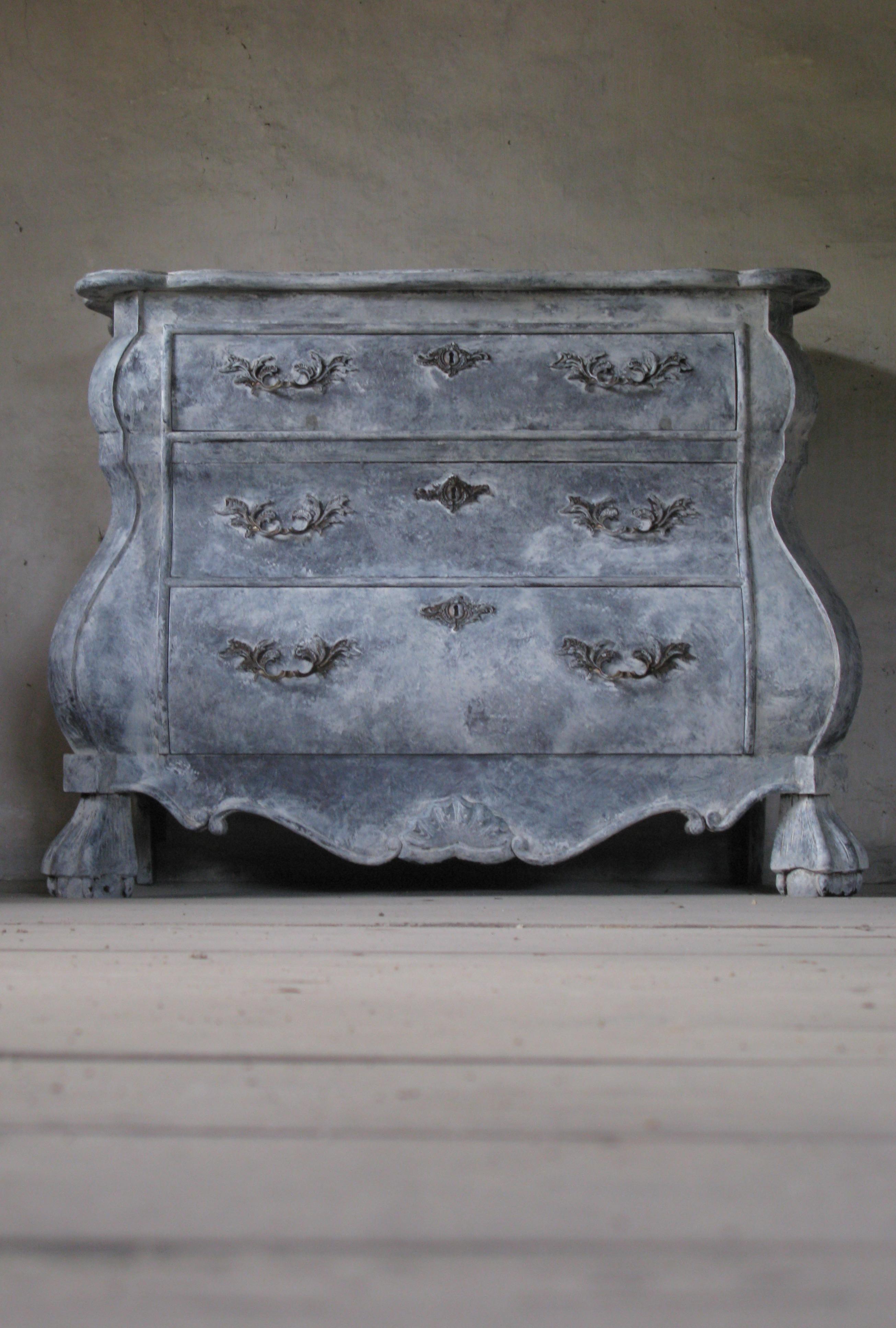 A Baroque style Dutch painted wood bombé three-drawer commode from my home country

This commode was born in the Netherlands and features a shaped top with beveled edges over three drawers, the upper one being smaller than the lower two. These