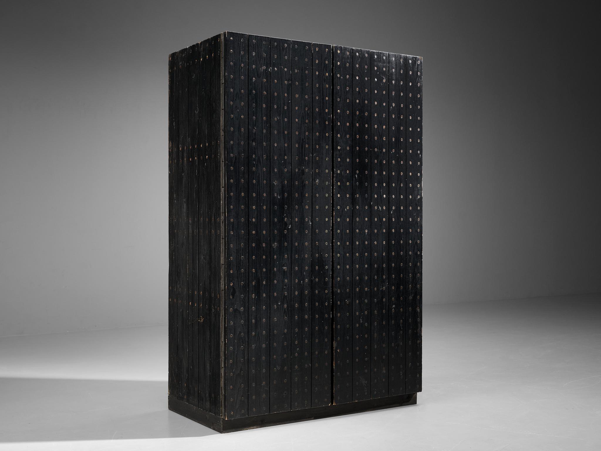 Dutch cabinet, pine, metal, The Netherlands, 1970s

This striking cabinet originates from The Netherlands. Its cubic appearance is emphasized by the dark colored wood. Vertically arranged slats in pine structure the cabinet in a rhythmic way. A