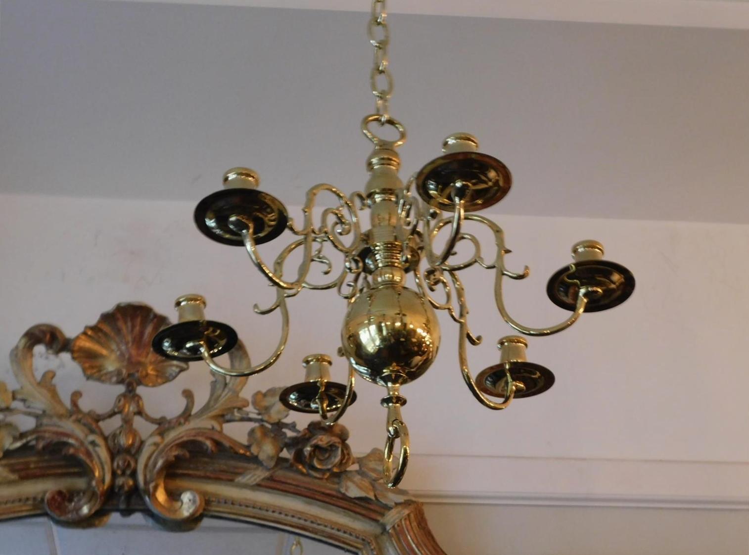 Dutch brass diminutive chandelier with six scrolled spur arms, central bulbous column, original bobeches with candle cups, and terminating on a ball finial with decorative ring. Chandelier is candle powered but can be electrified if desired at no