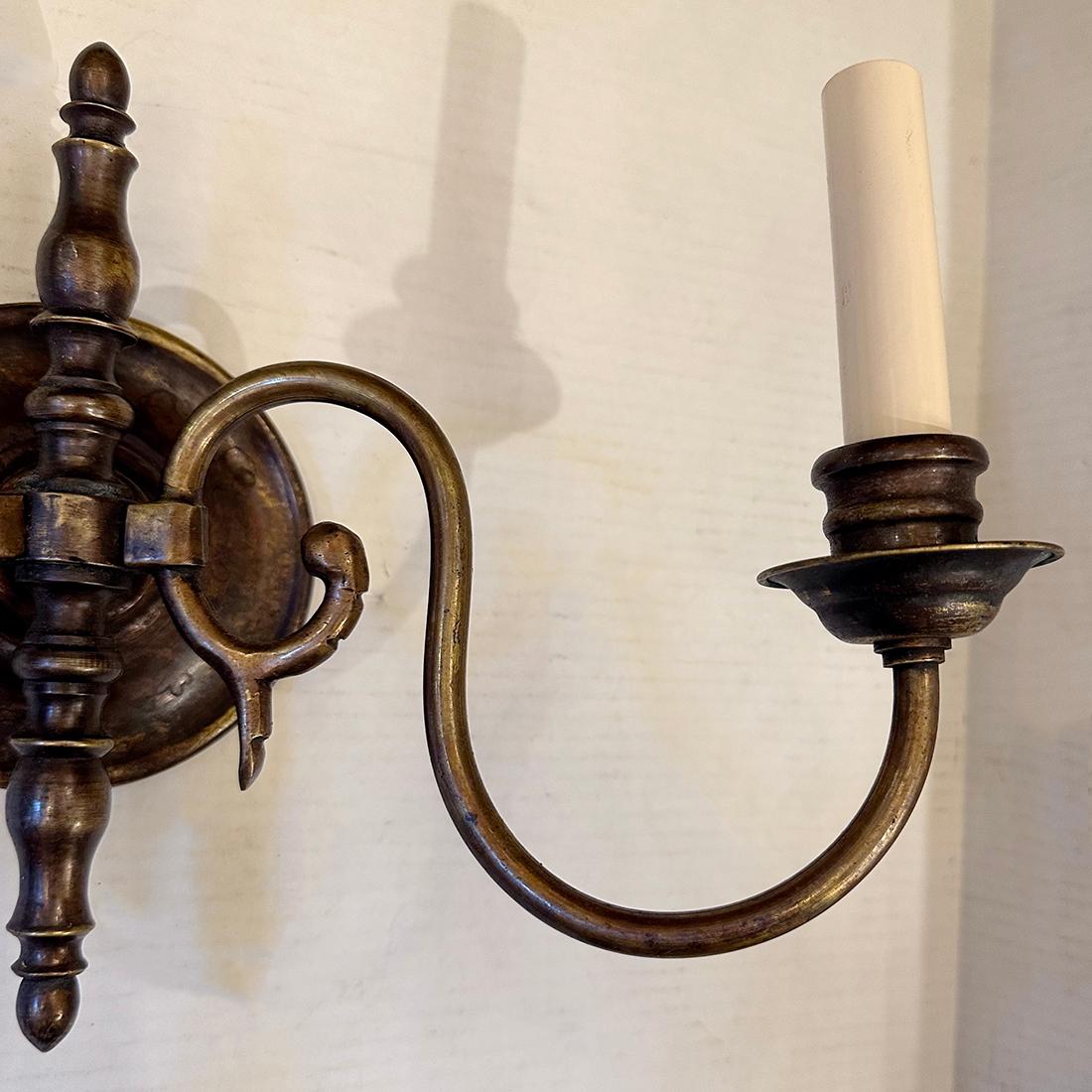 A pair of circa 1940's Dutch bronze sconces.

Measurements:
Height: 9