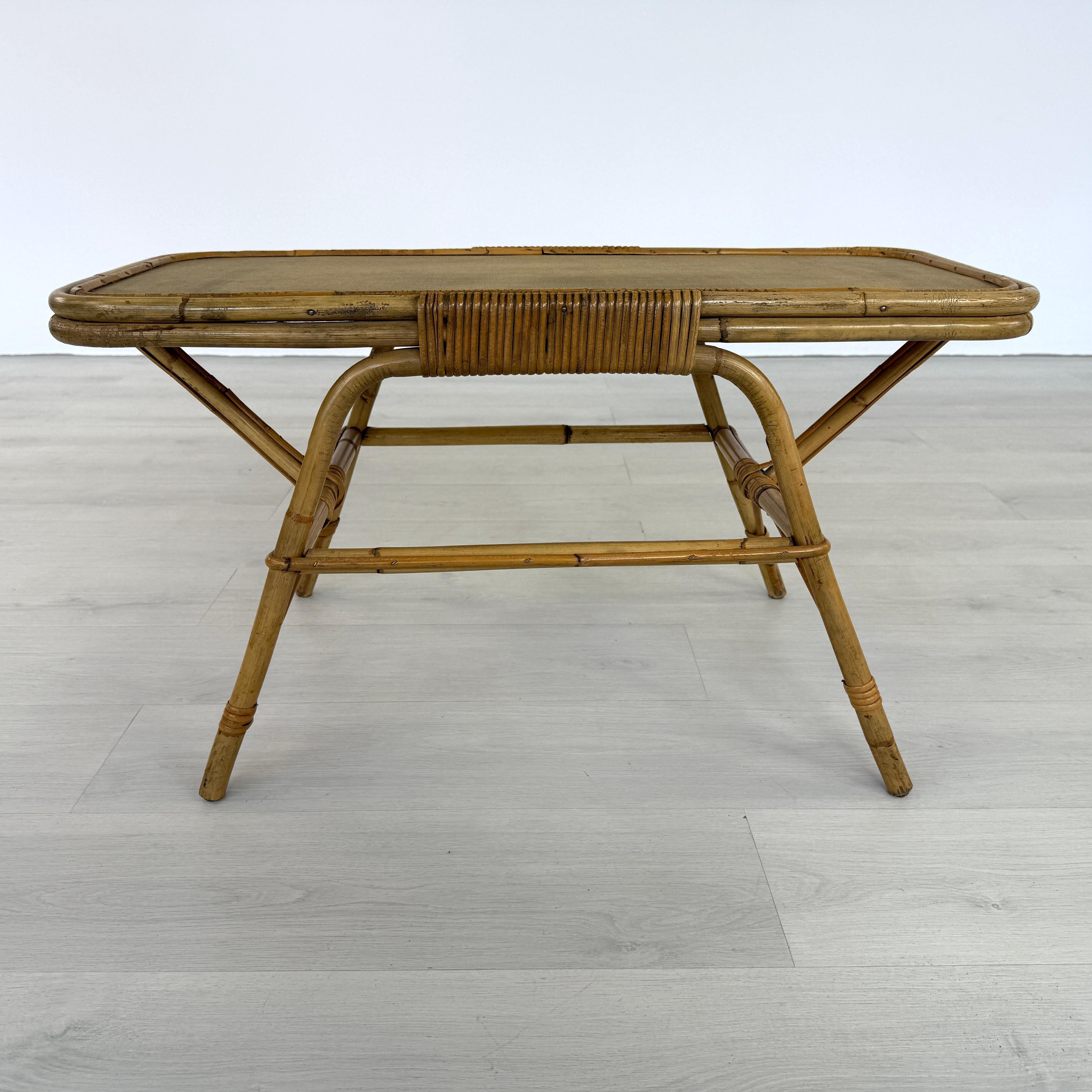 Dimensions: H 18” x W 33” x D 15”

Vintage Dutch coffee or side table with cane frame and textured brown top by Dirk van Sliedregt for Rohé Noordwolde, Netherlands. Rattan furniture is a great choice for living room, terrace or cottage.

Please see