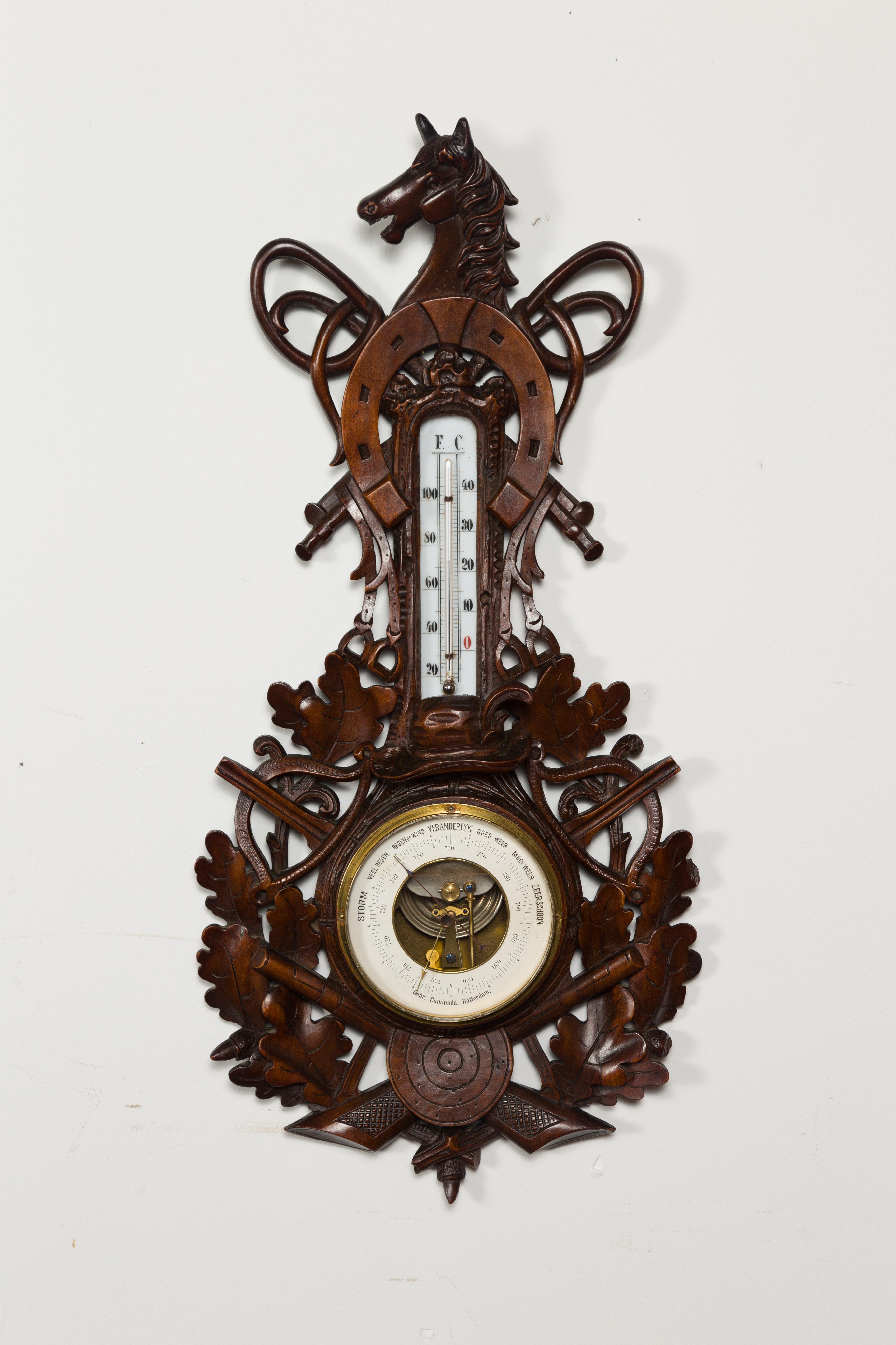 A Dutch carved wooden barometer from the late 19th century, with horse motif, signed by Gebroeders Caminada, Rotterdam. Hand carved in the Netherlands by the Gebroeders Caminada Company established in Rotterdam in 1856, this wooden barometer