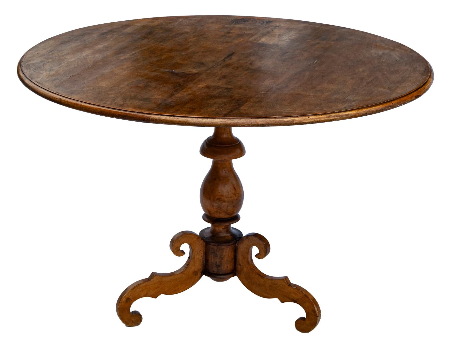 A fine Dutch Colonial fruitwood round center table supported by a center pedestal with tripod cabriole legs. Crafted in the 1800’'s.
The top is veneered, the veneer is well worn in some spots.
The moderate size & classic design make it easy to