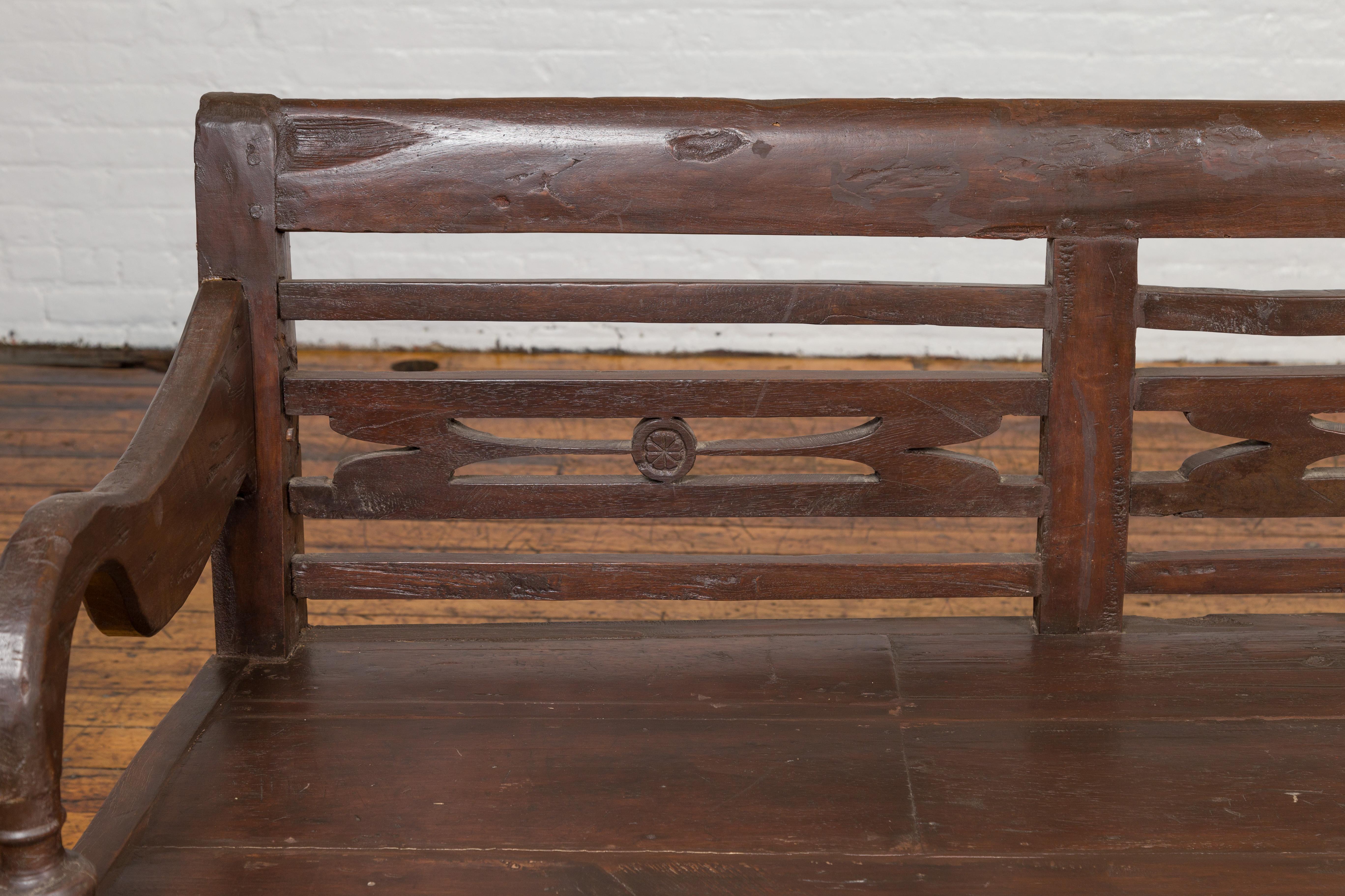 Indonesian Dutch Colonial 19th Century Teak Bench with Pierced Back and Scrolling Arms