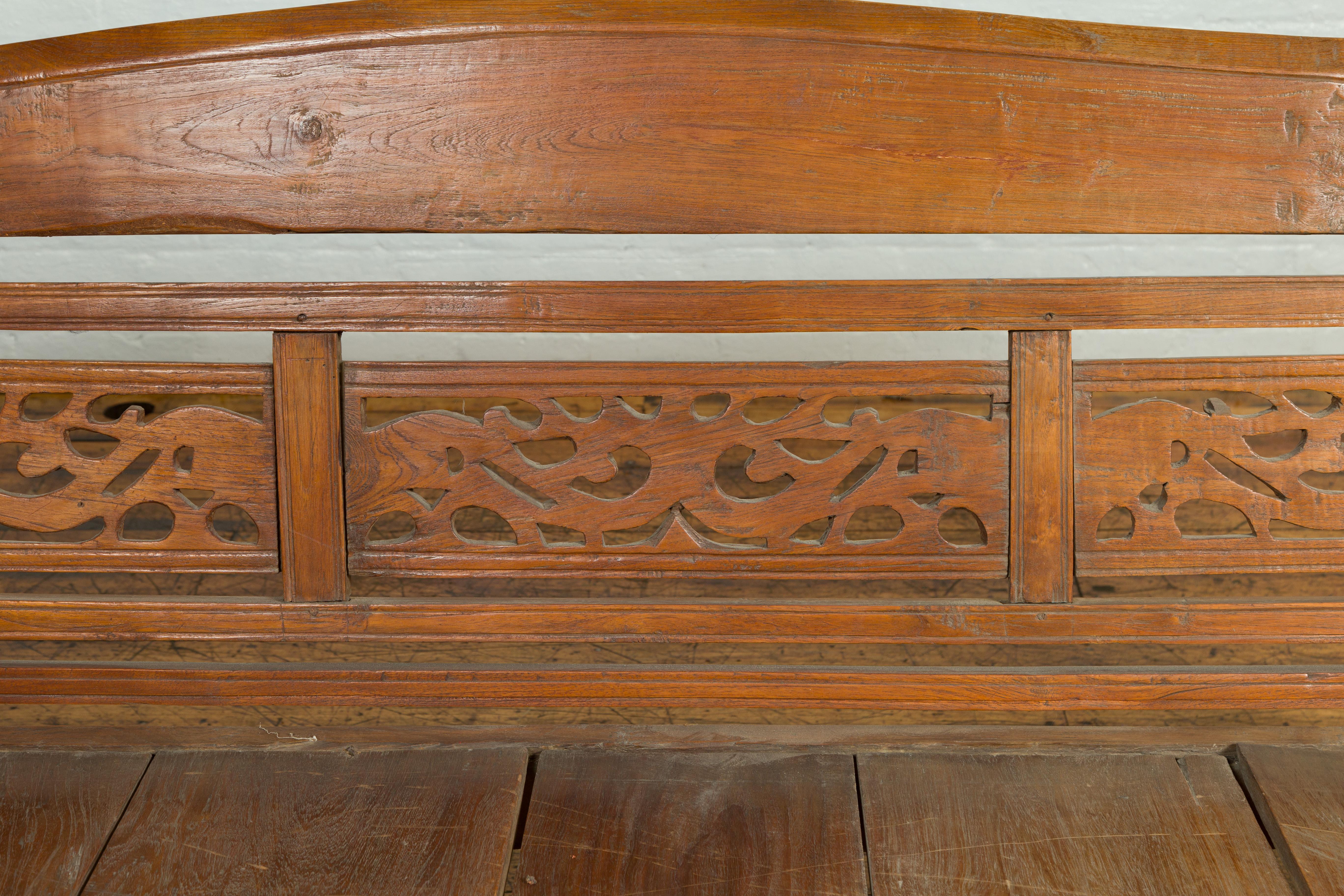 antique wooden bench with back and arms