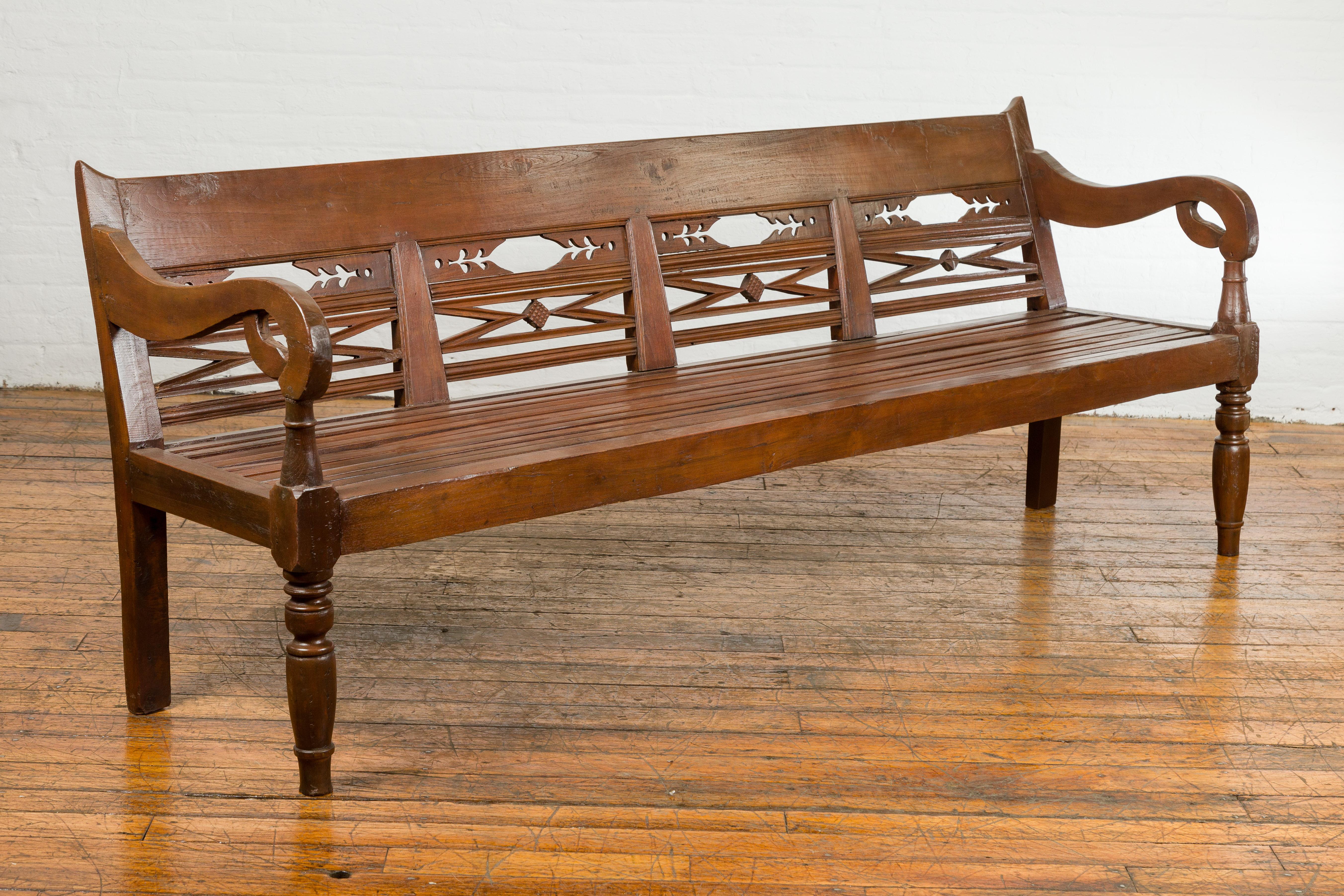 Dutch Colonial Bench with Carved Back, Scrolling Arms and Turned Baluster Legs For Sale 4