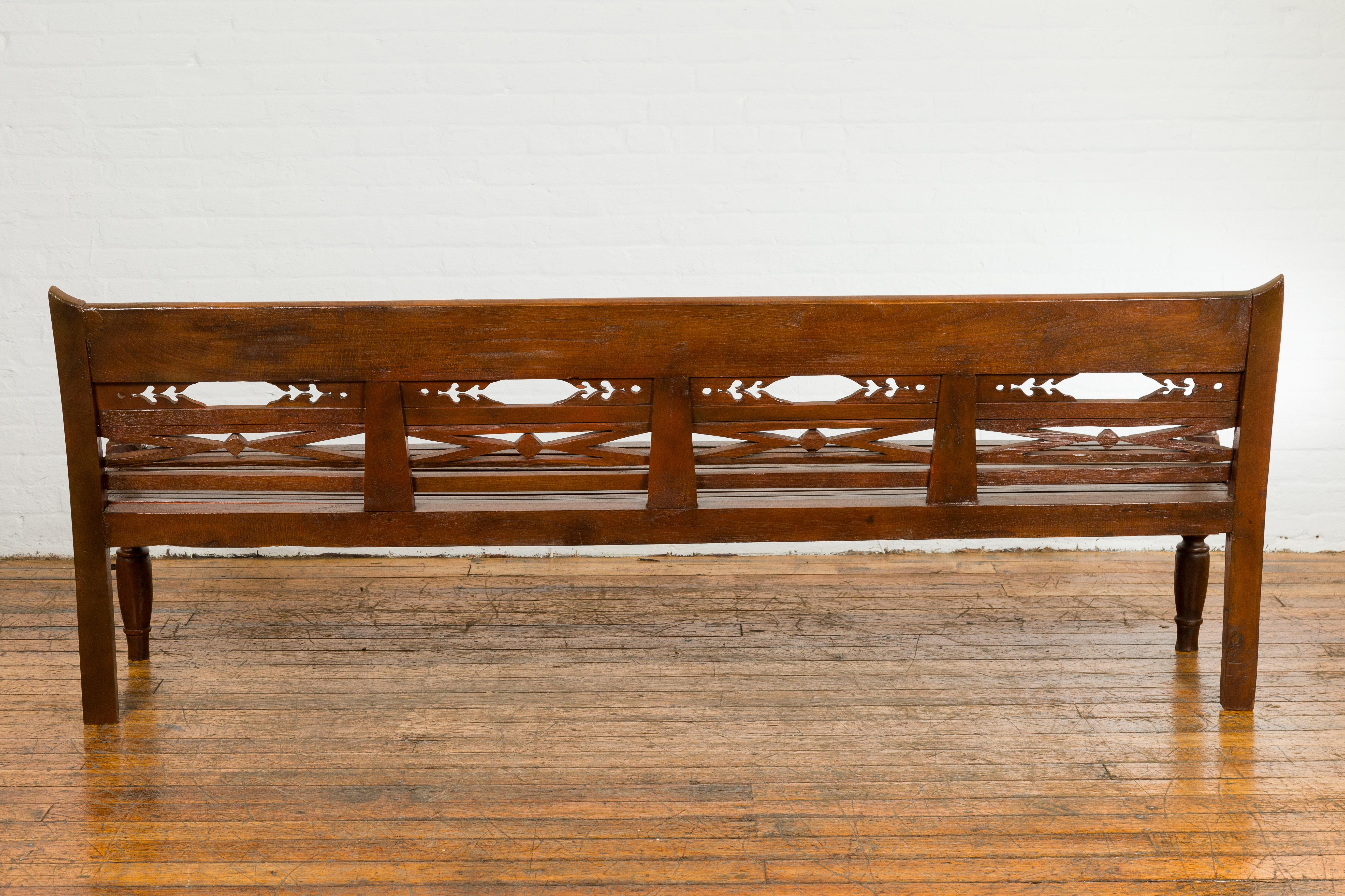Dutch Colonial Bench with Carved Back, Scrolling Arms and Turned Baluster Legs For Sale 8
