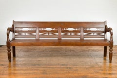 Dutch Colonial Bench with Carved Back, Scrolling Arms and Turned Baluster Legs