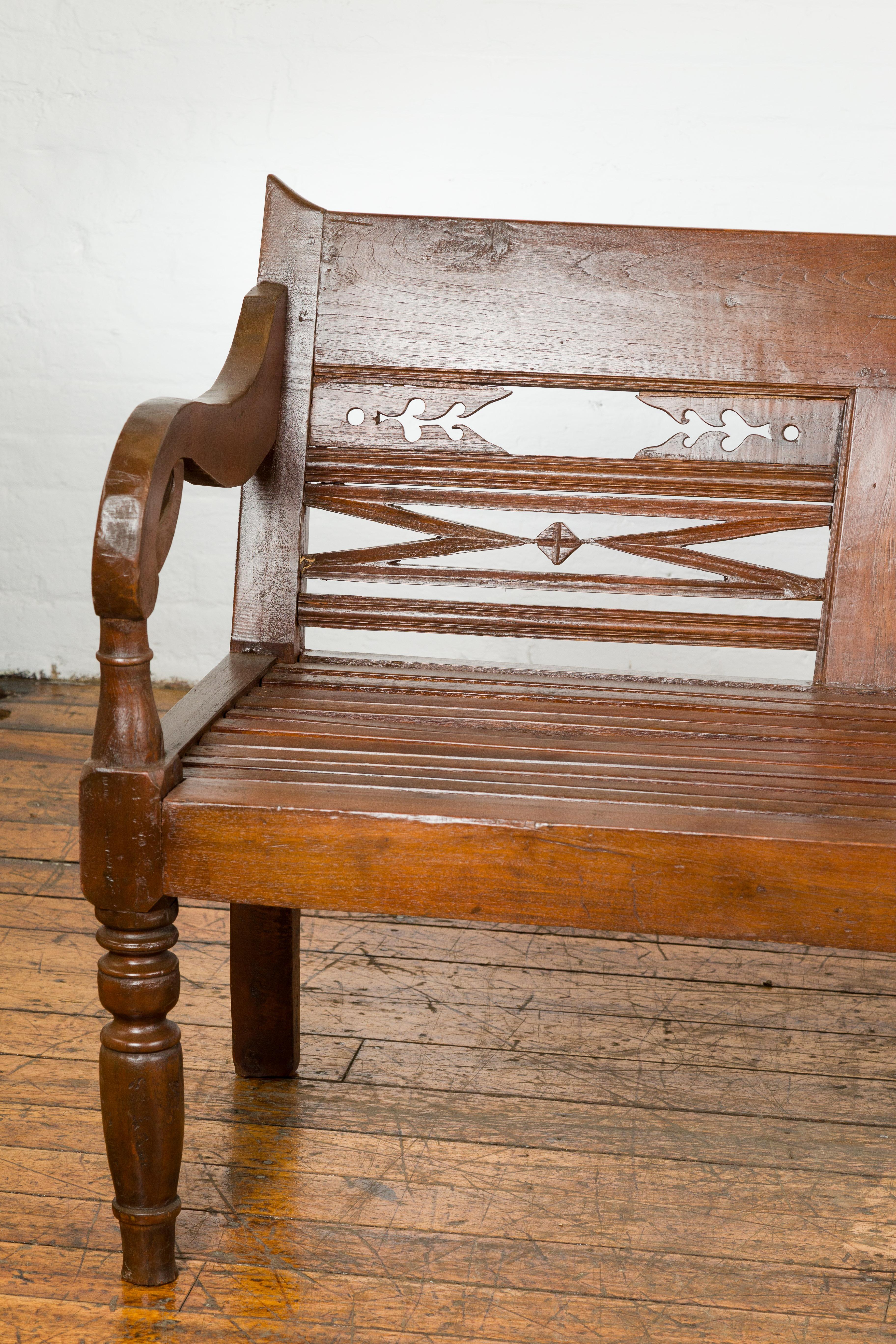 Dutch Colonial Bench with Carved Back, Scrolling Arms and Turned Baluster Legs In Good Condition For Sale In Yonkers, NY