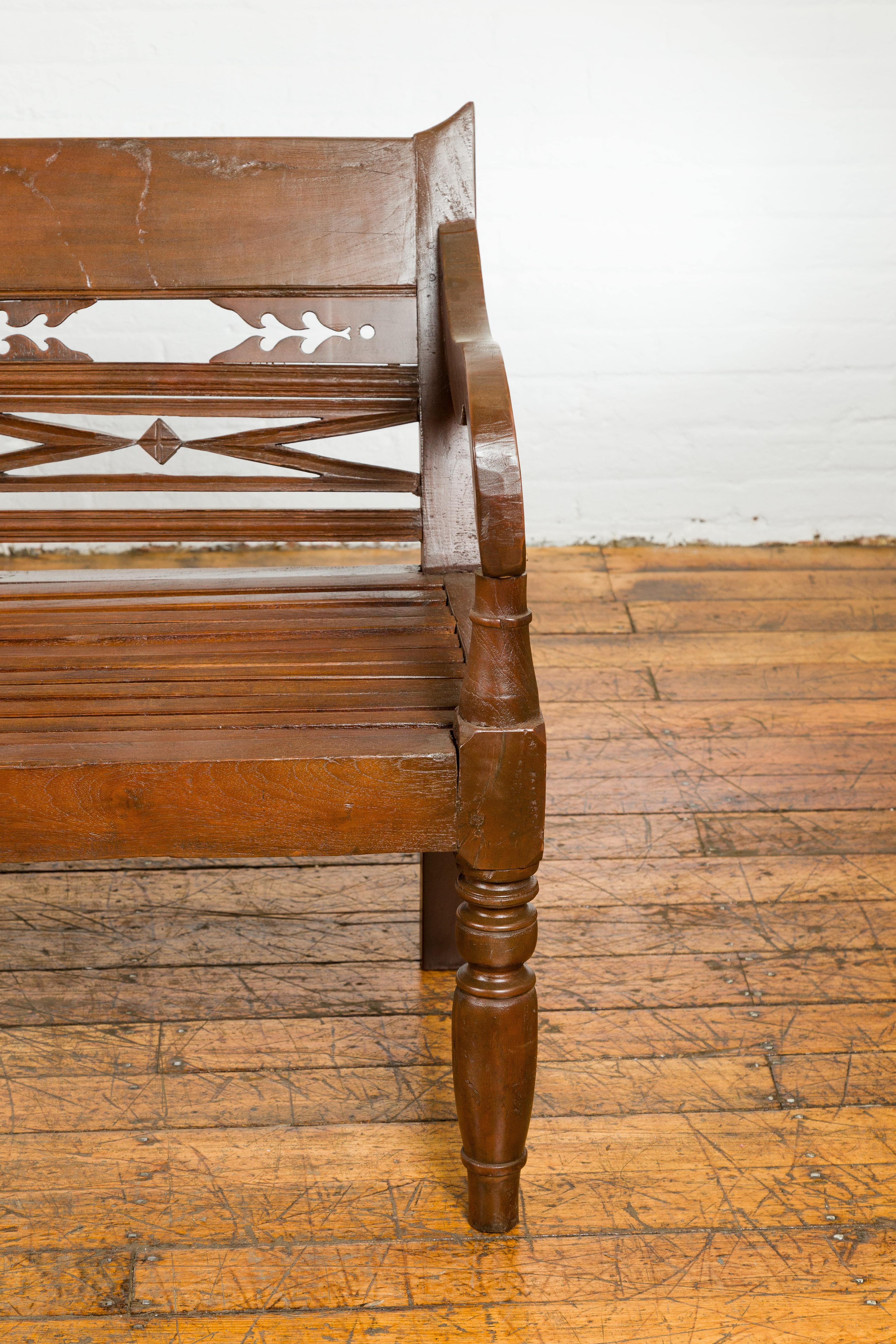 Dutch Colonial Bench with Carved Back, Scrolling Arms and Turned Baluster Legs For Sale 3