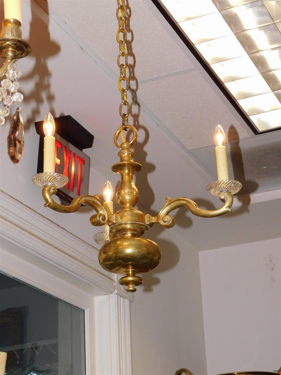 Dutch Colonial bronze and crystal bobeche three scrolled arm bulbous chandelier. Chandelier was originally candle powered and has been electrified. Early 19th century.