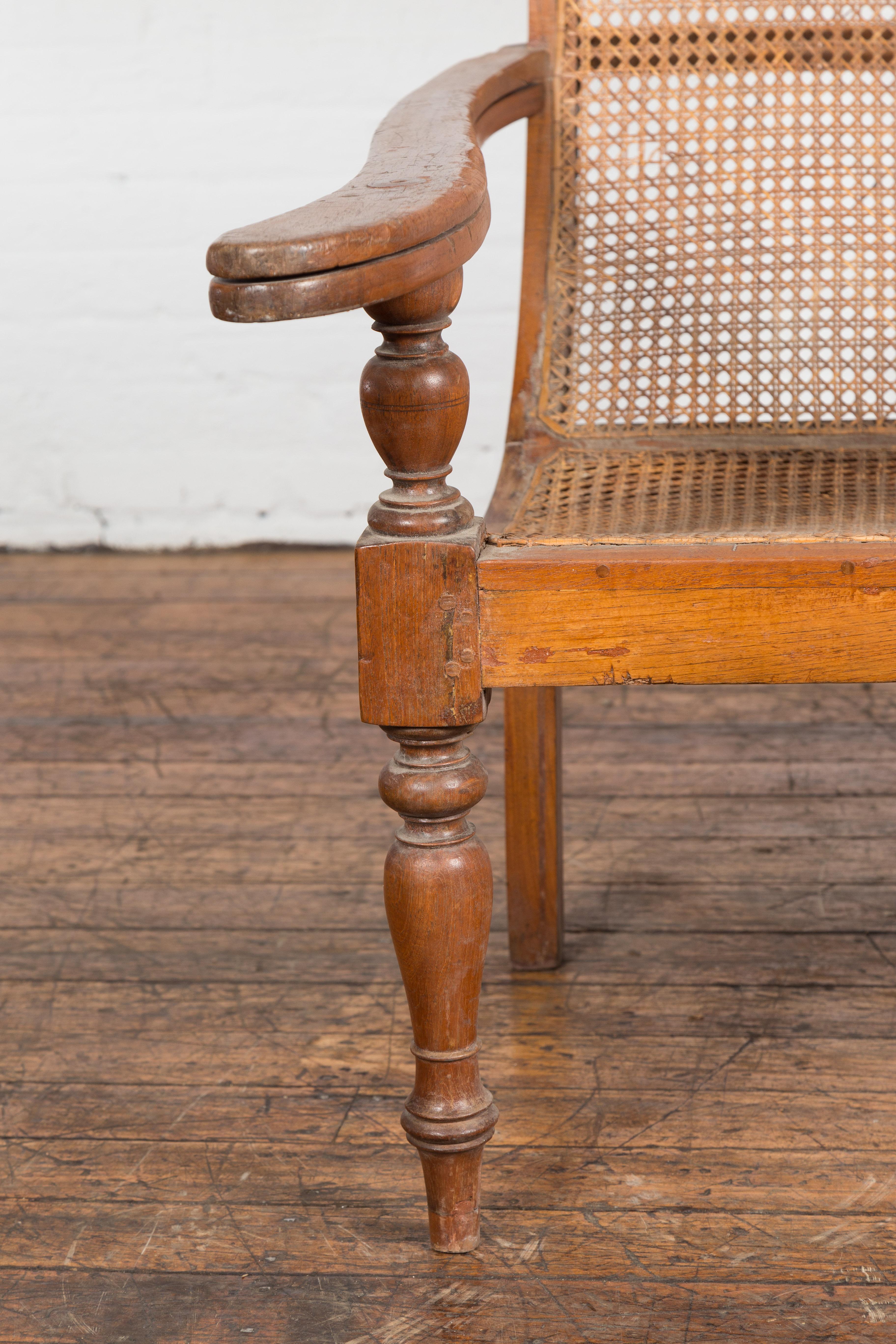 Dutch Colonial Indonesian Cane and Wood Plantation Chair with Extending Arms For Sale 6
