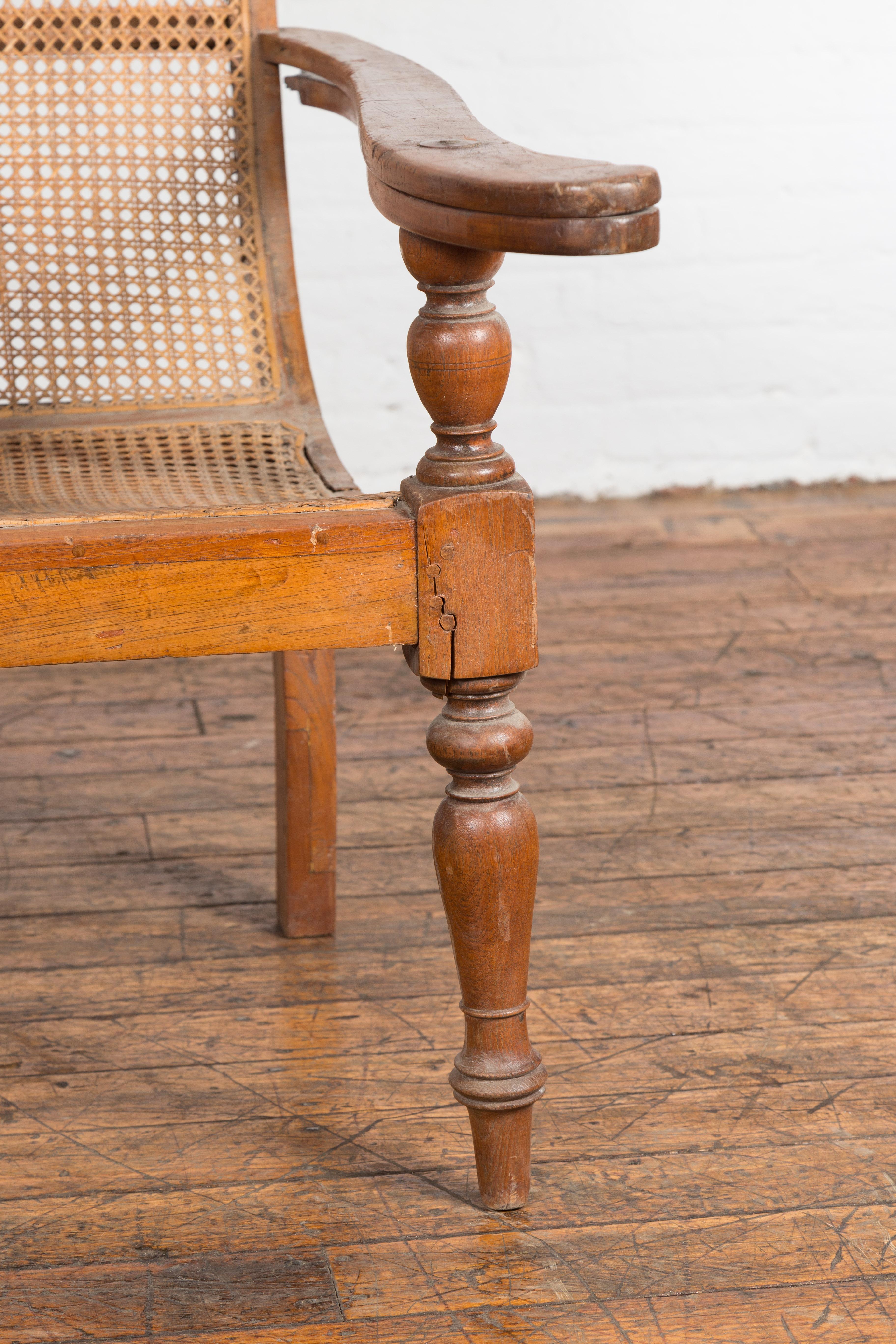 Dutch Colonial Indonesian Cane and Wood Plantation Chair with Extending Arms For Sale 9