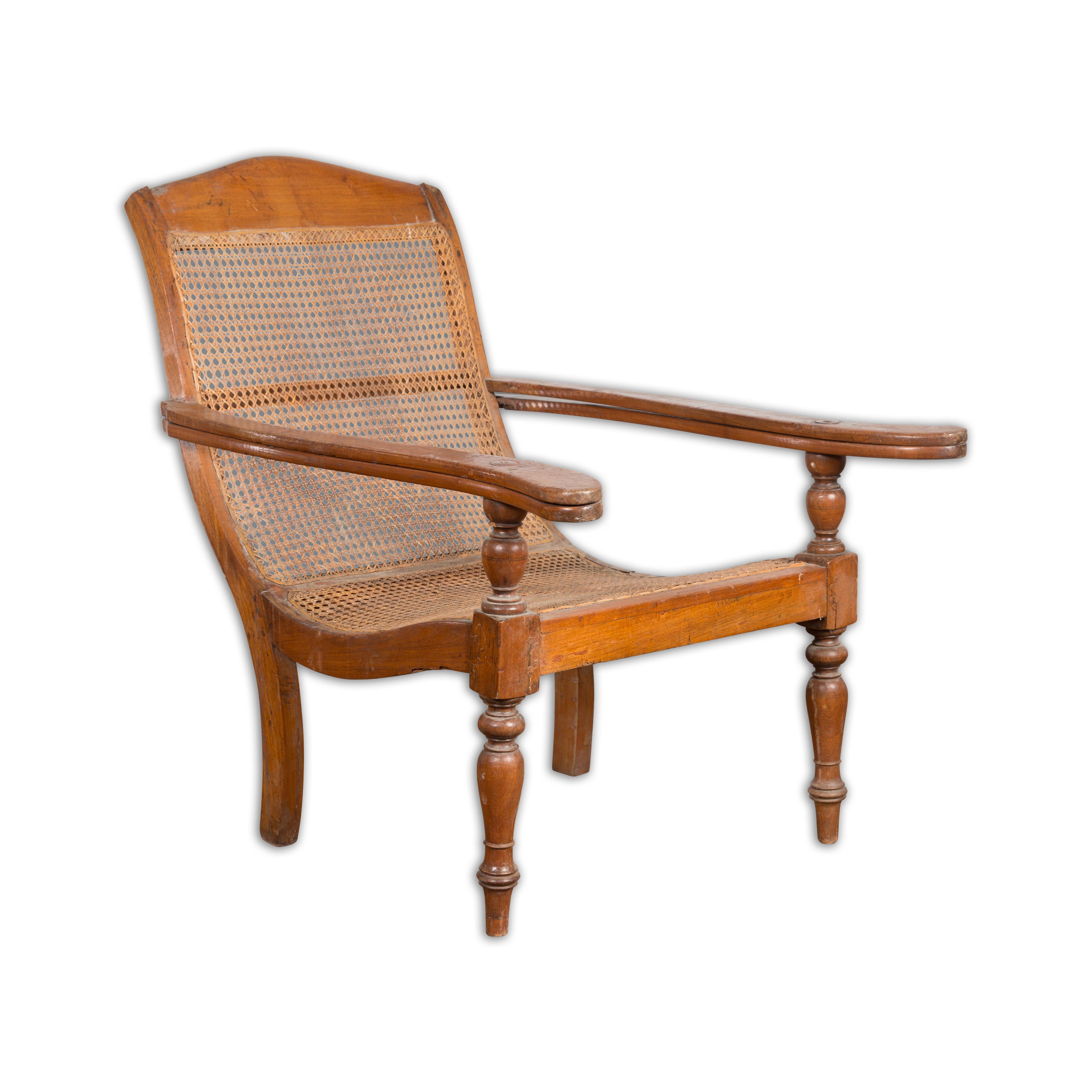Dutch Colonial Indonesian Cane and Wood Plantation Chair with Extending Arms For Sale 14