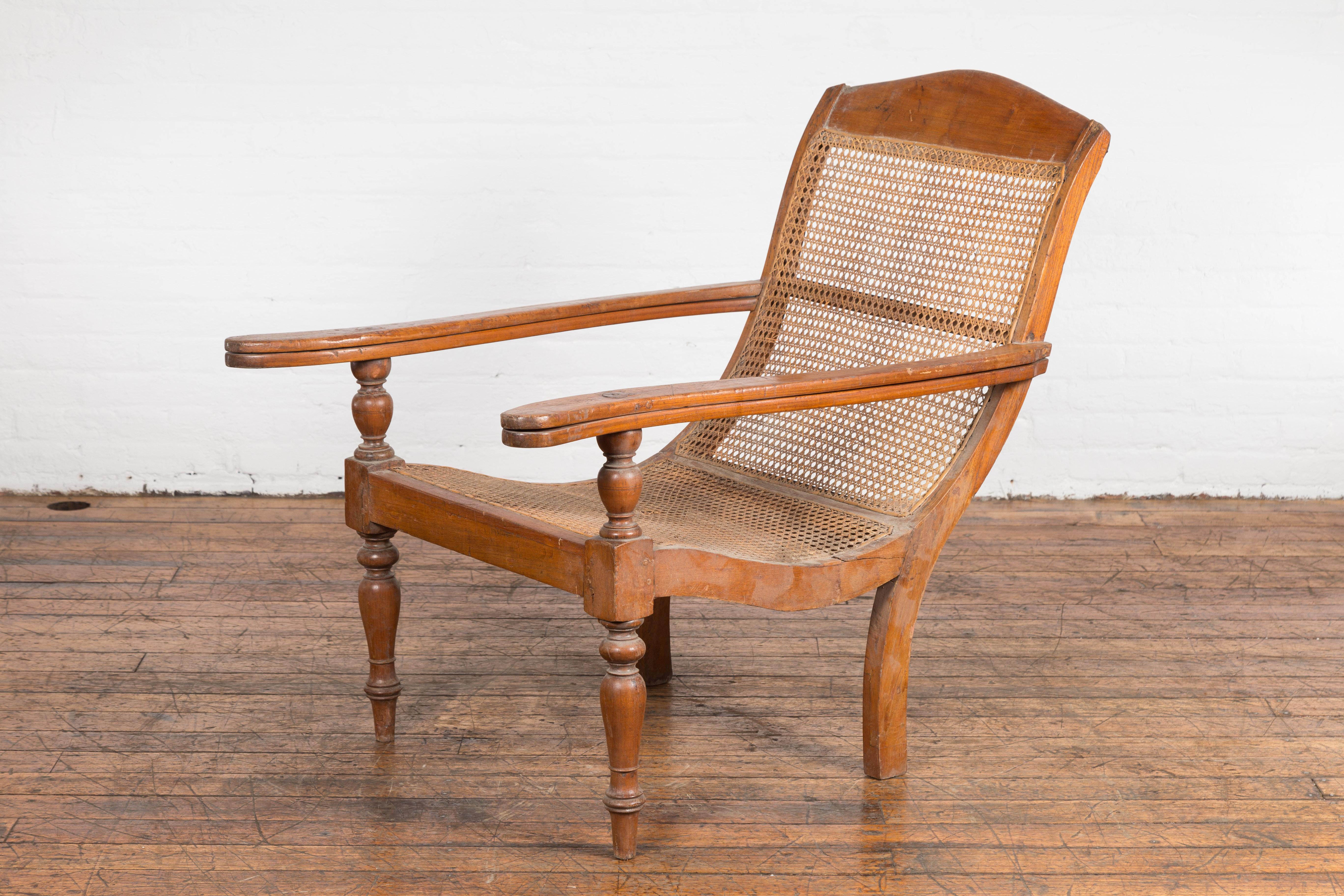 Turned Dutch Colonial Indonesian Cane and Wood Plantation Chair with Extending Arms For Sale