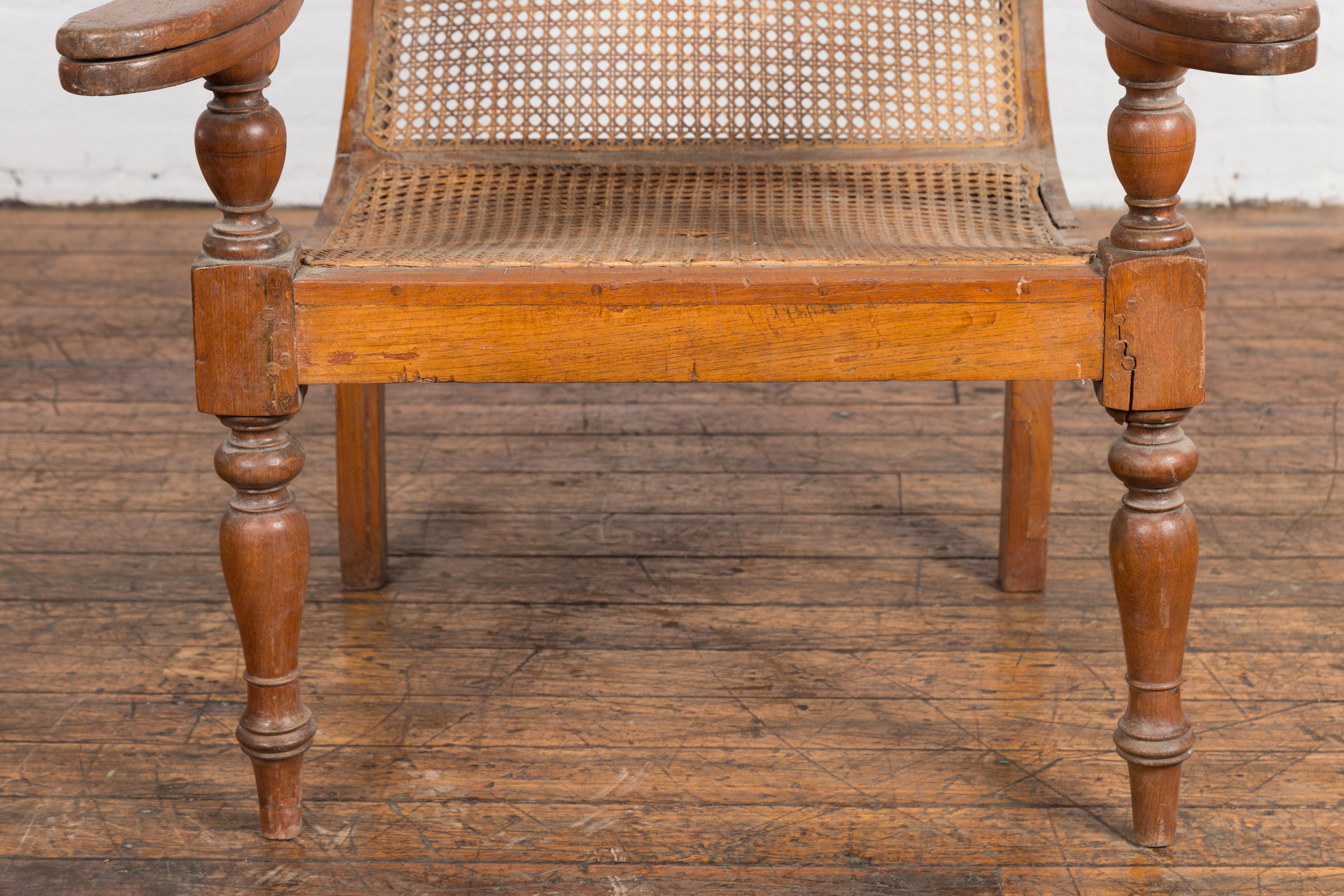 Dutch Colonial Indonesian Cane and Wood Plantation Chair with Extending Arms In Good Condition For Sale In Yonkers, NY