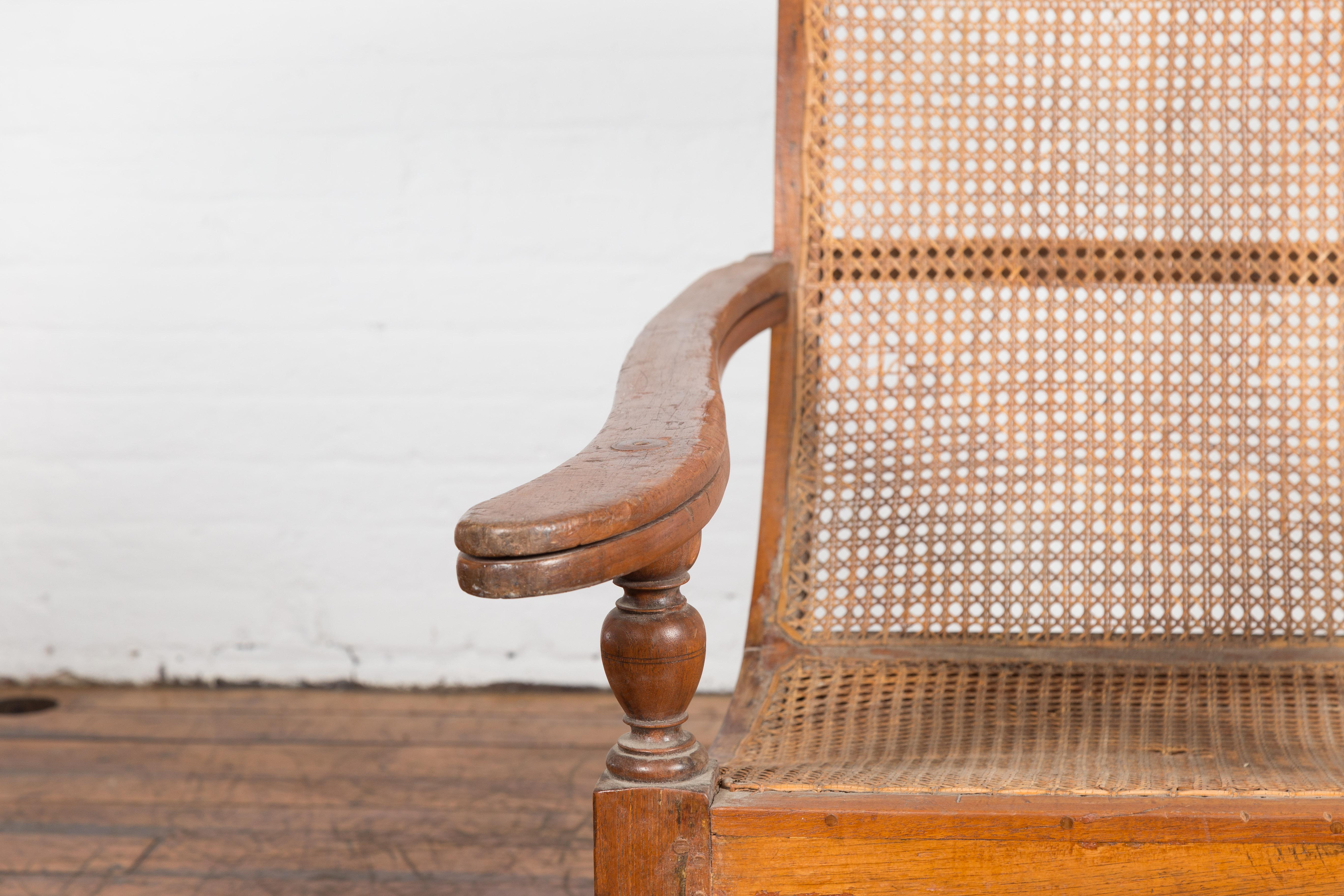 20th Century Dutch Colonial Indonesian Cane and Wood Plantation Chair with Extending Arms For Sale