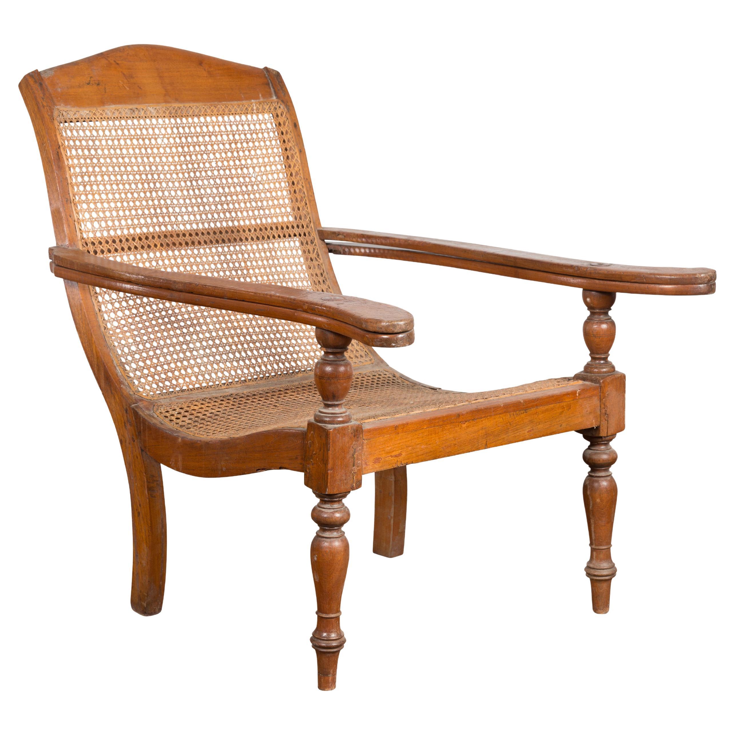 Dutch Colonial Indonesian Cane and Wood Plantation Chair with Extending Arms For Sale