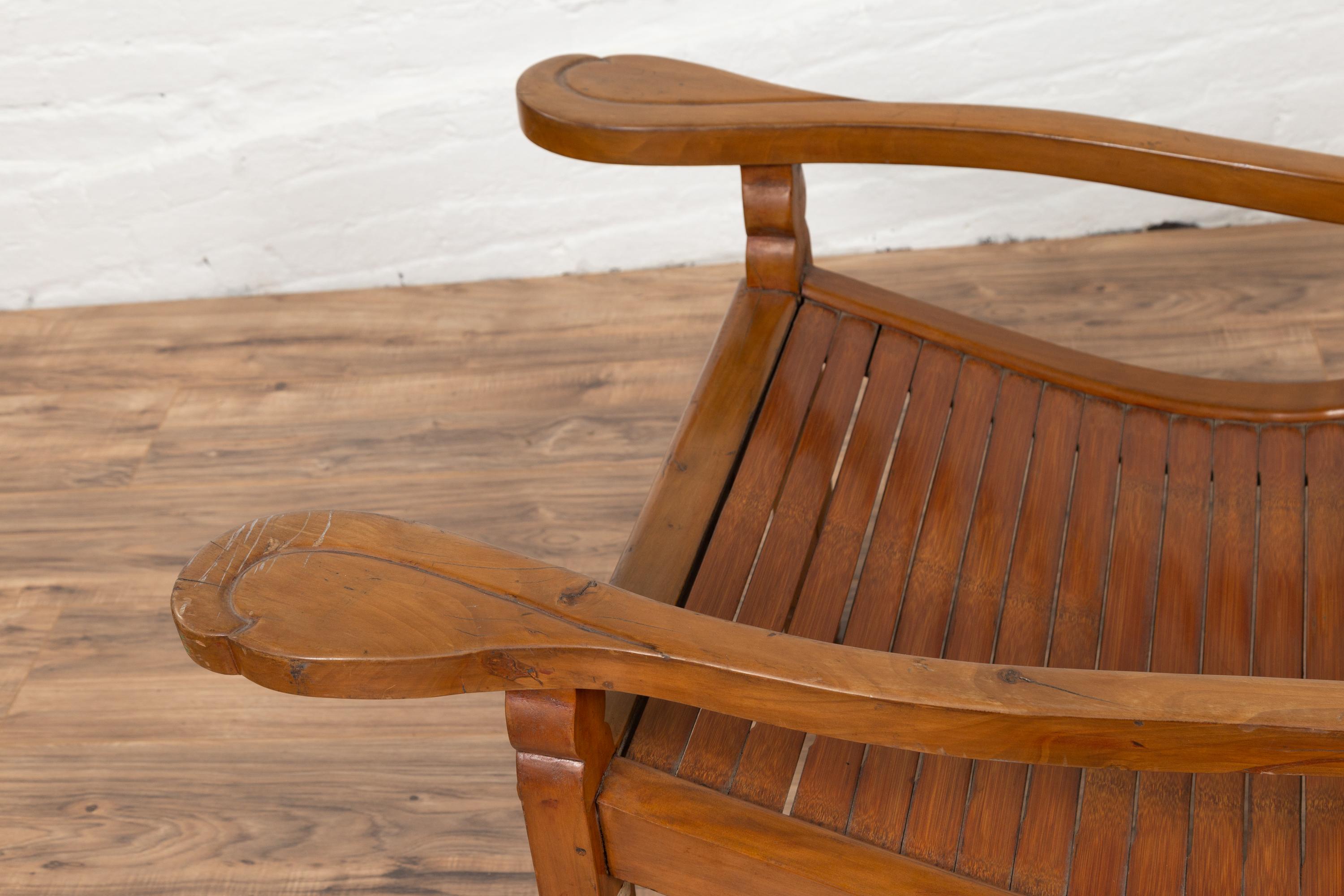 20th Century Dutch Colonial 1900s Plantation Lounge Chair with Curving Seat and Slats For Sale