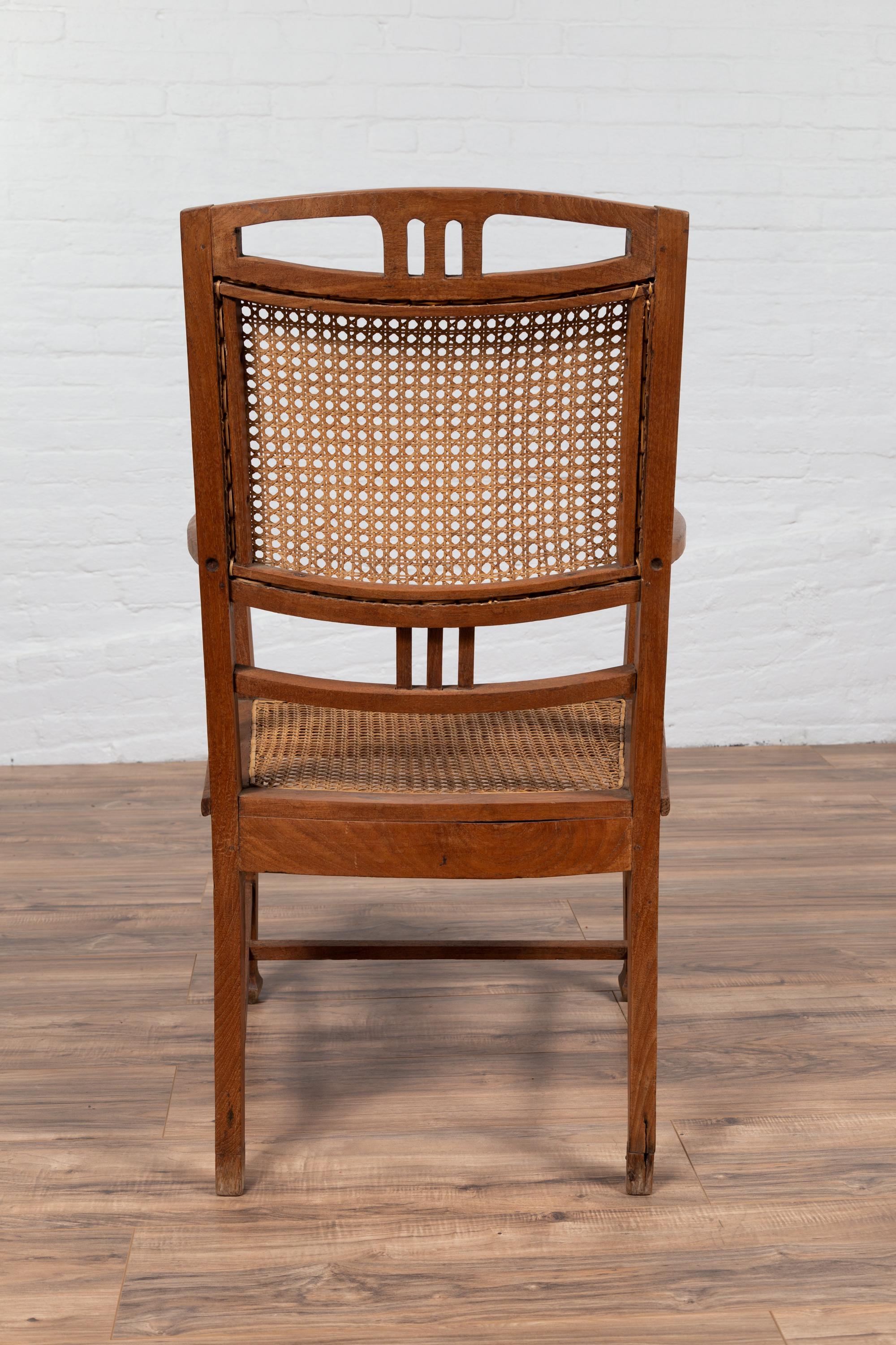 Dutch Colonial Javanese Teak Armchair with Rattan and Triglyph Inspired Motifs For Sale 6
