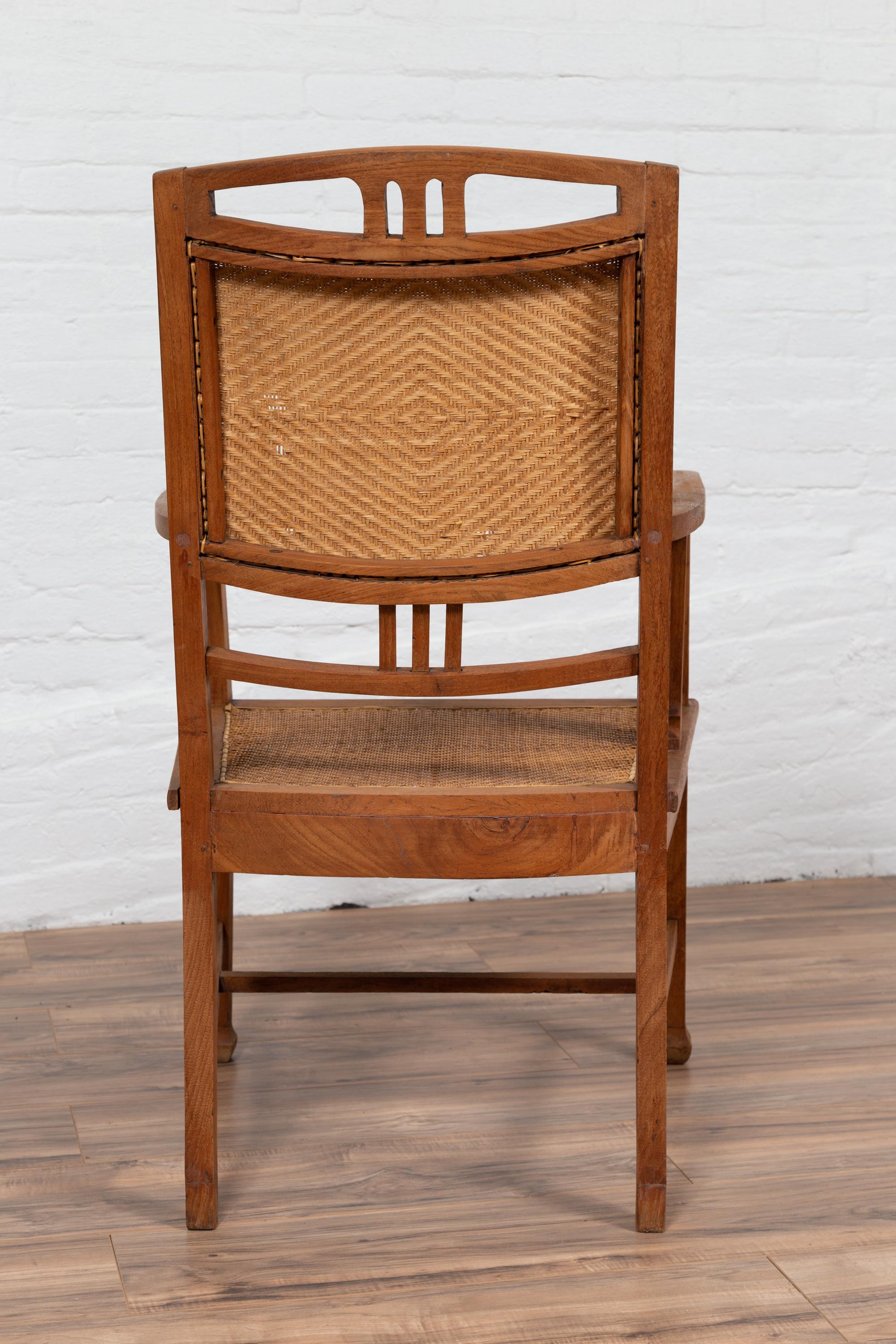 Dutch Colonial Javanese Teak Armchair with Rattan and Triglyph Inspired Motifs For Sale 5
