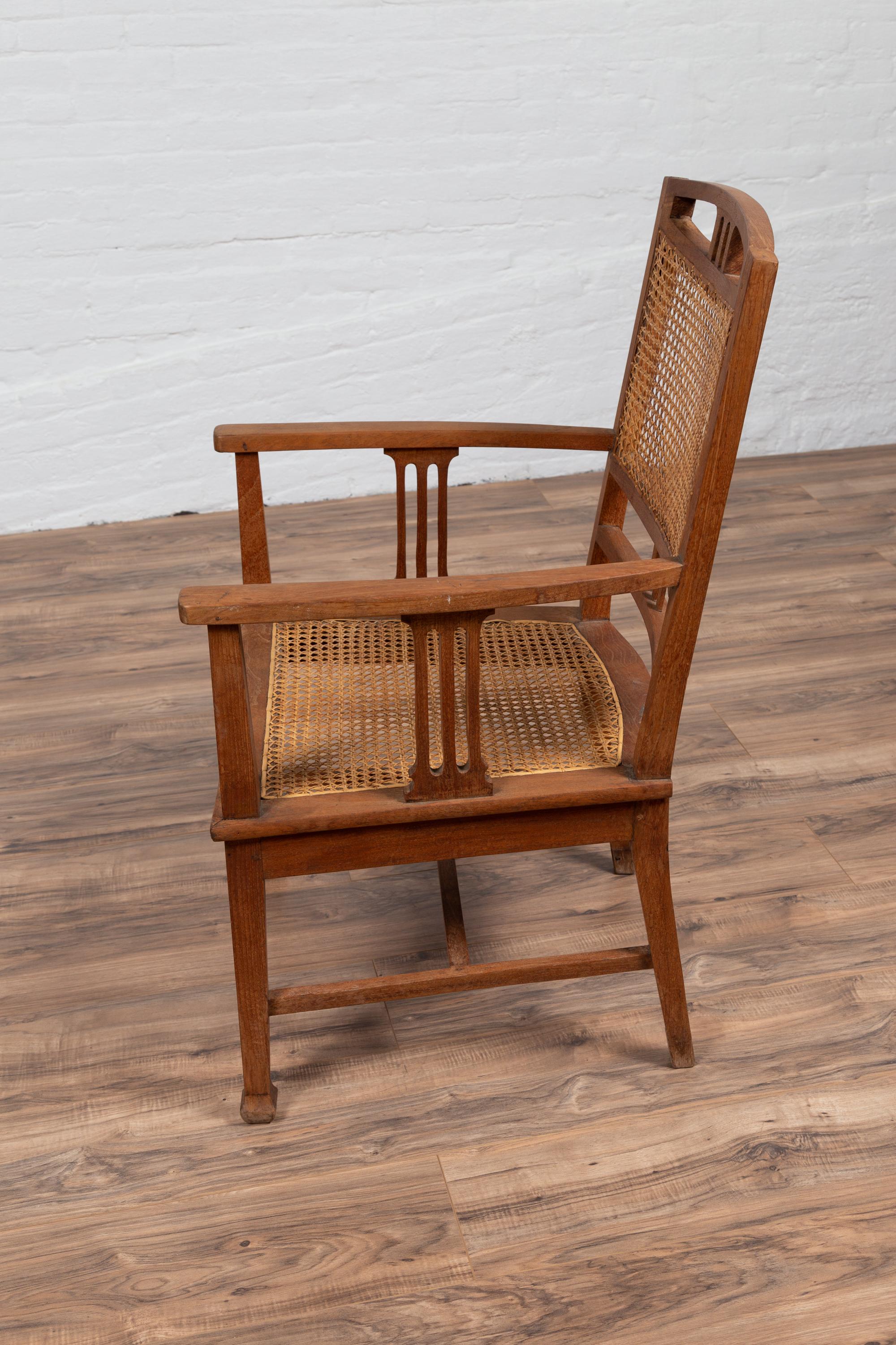 Dutch Colonial Javanese Teak Armchair with Rattan and Triglyph Inspired Motifs For Sale 9