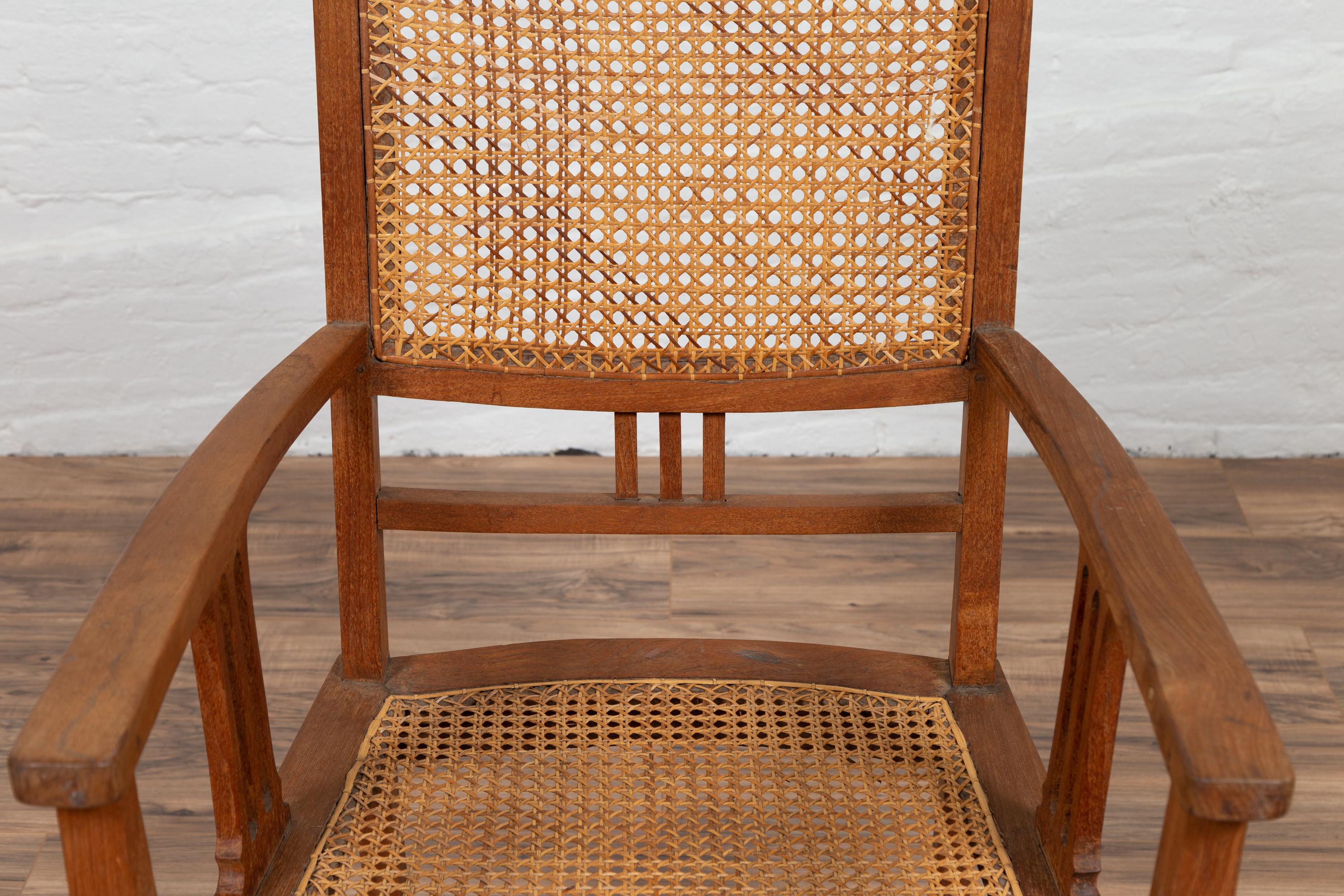 Woven Dutch Colonial Javanese Teak Armchair with Rattan and Triglyph Inspired Motifs For Sale