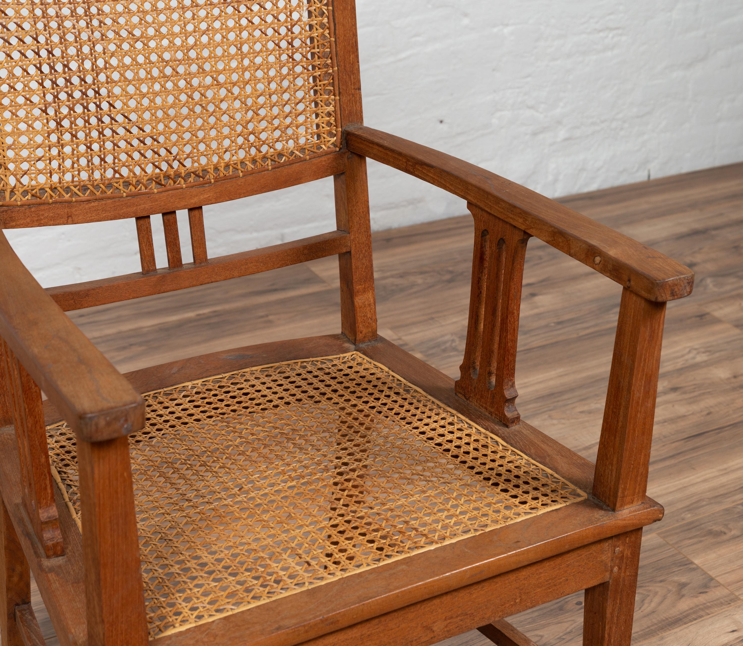 Dutch Colonial Javanese Teak Armchair with Rattan and Triglyph Inspired Motifs In Good Condition For Sale In Yonkers, NY