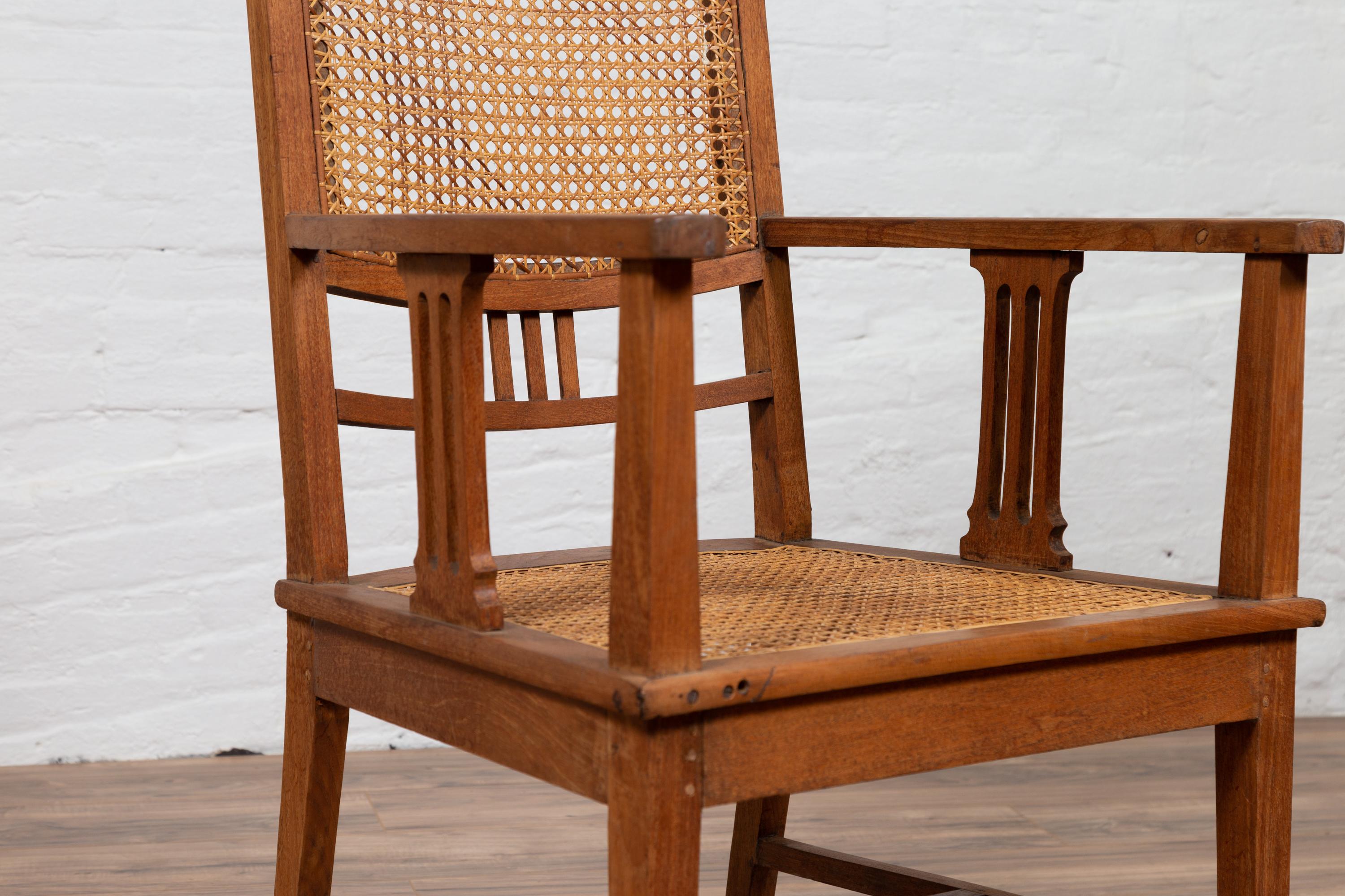 Dutch Colonial Javanese Teak Armchair with Rattan and Triglyph Inspired Motifs For Sale 3