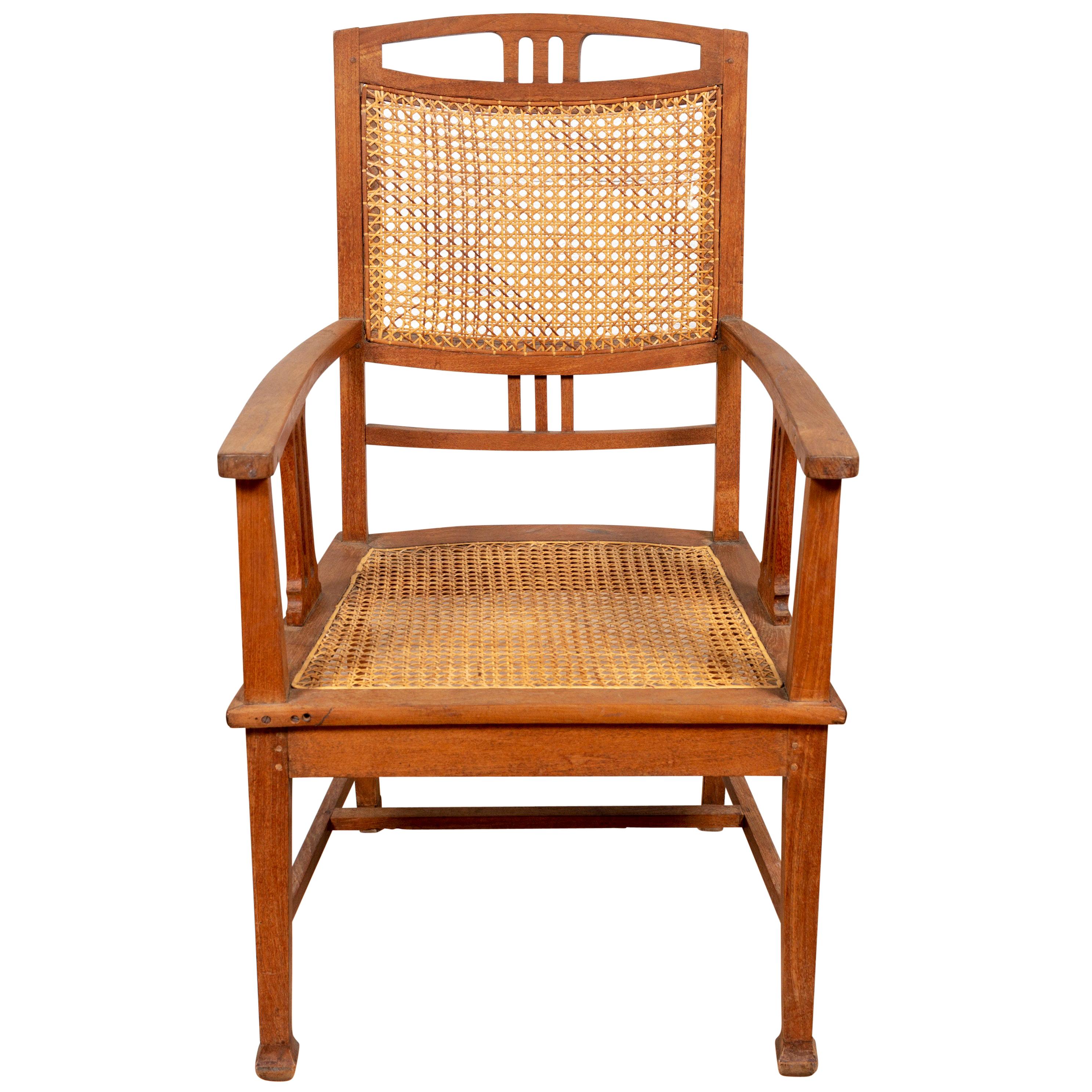 Dutch Colonial Javanese Teak Armchair with Rattan and Triglyph Inspired Motifs