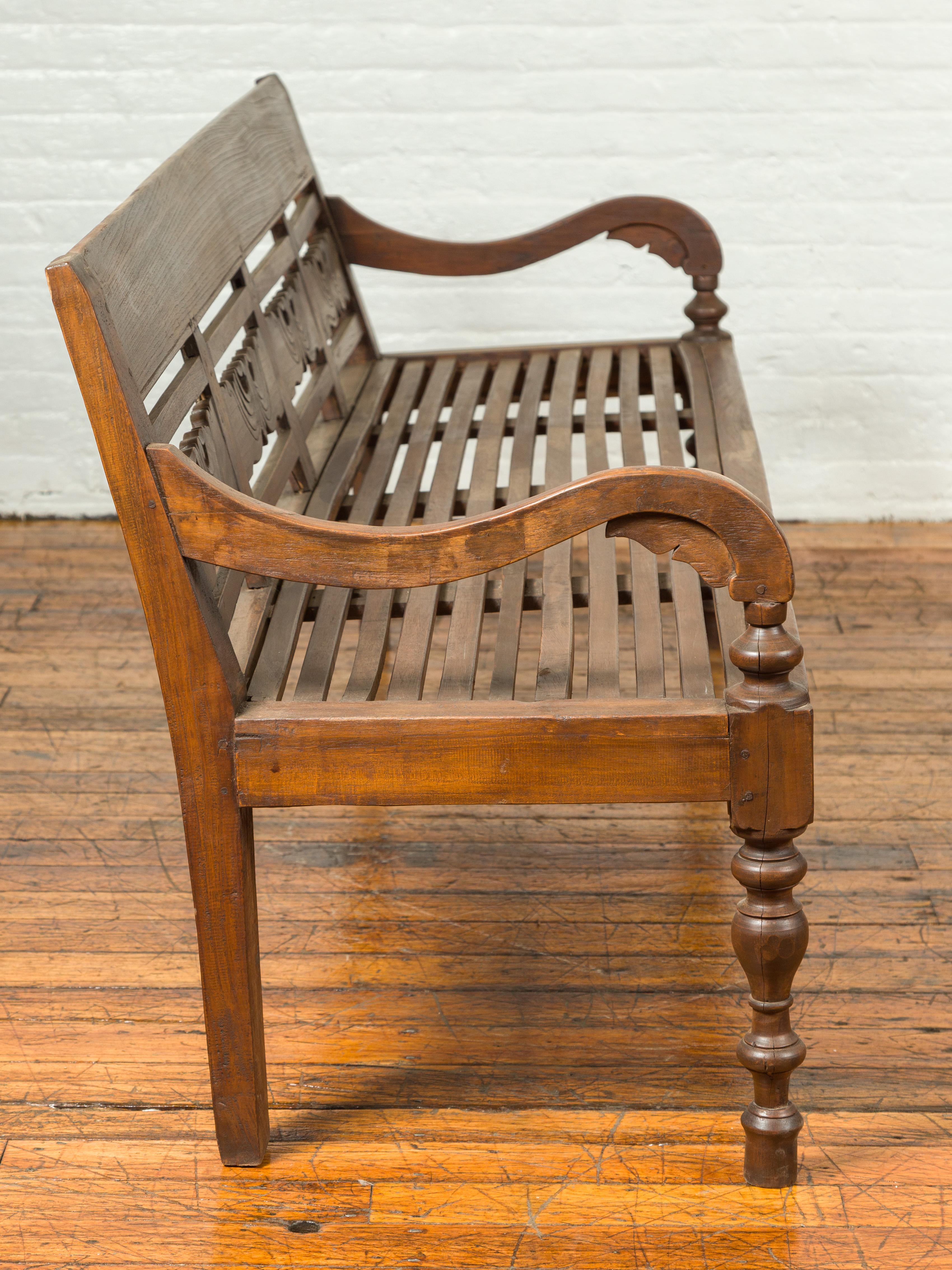 Dutch Colonial Late 19th Century Bench with Carved Back and Scrolling Arms 3