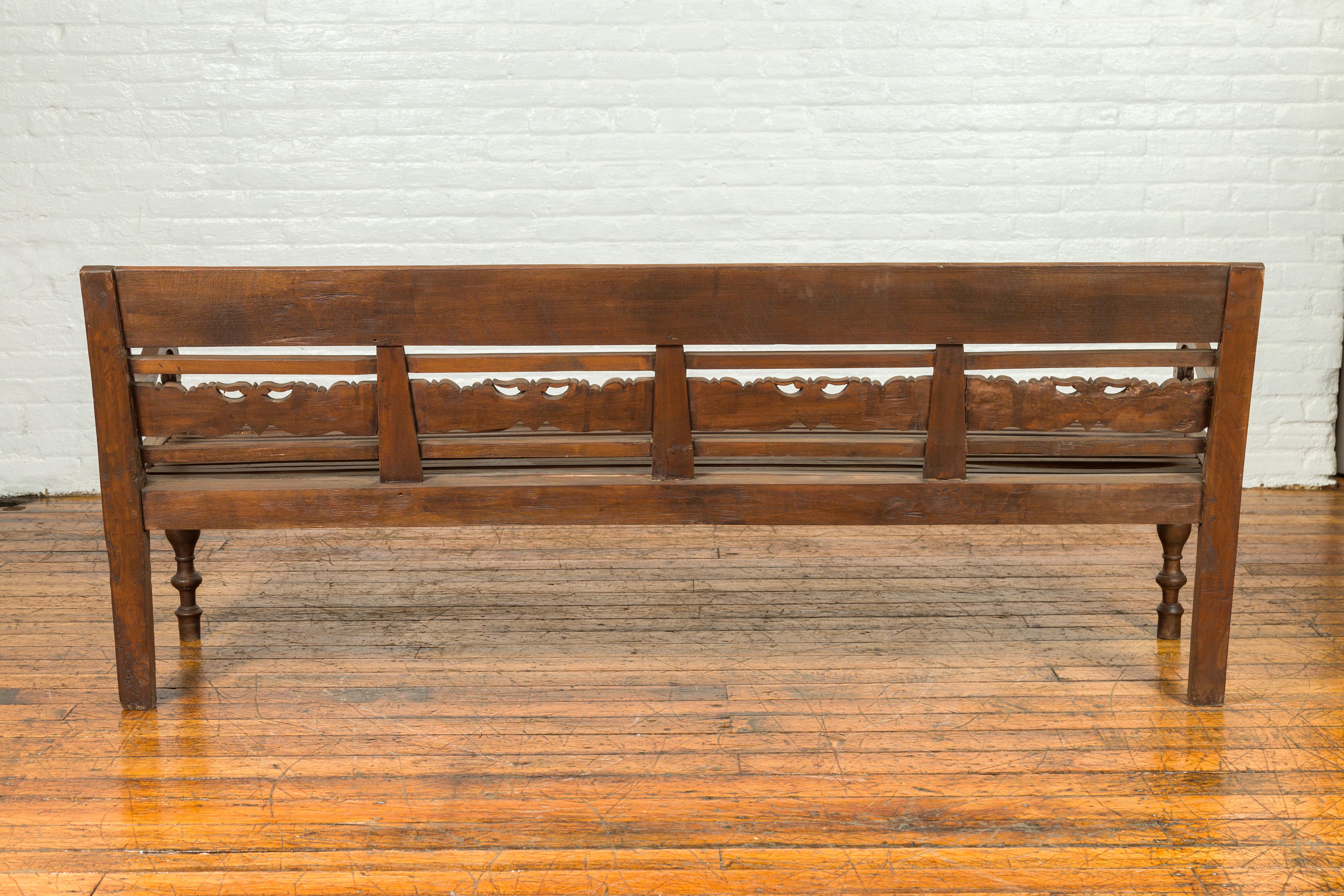 Dutch Colonial Late 19th Century Bench with Carved Back and Scrolling Arms 4