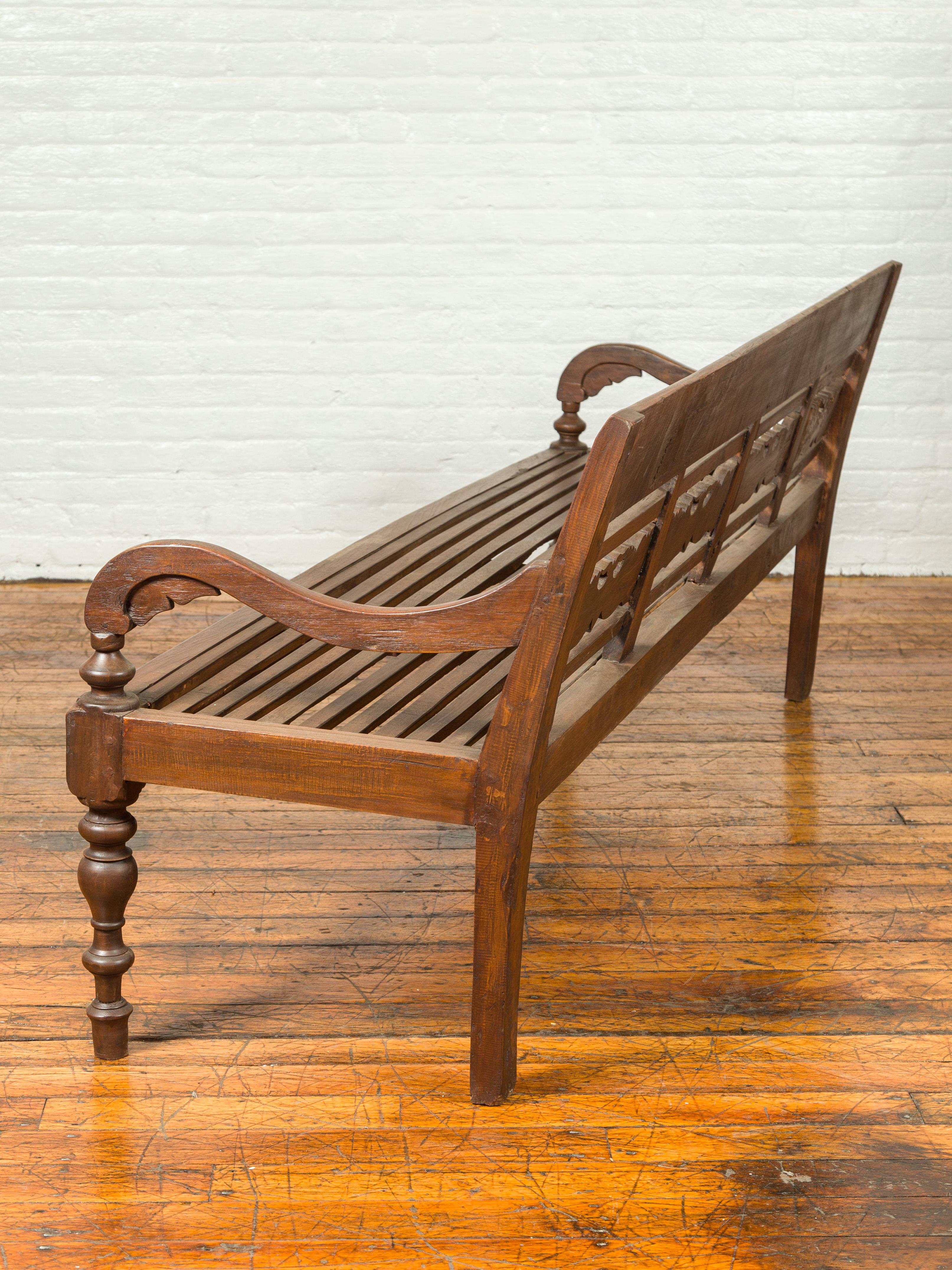 Dutch Colonial Late 19th Century Bench with Carved Back and Scrolling Arms 5